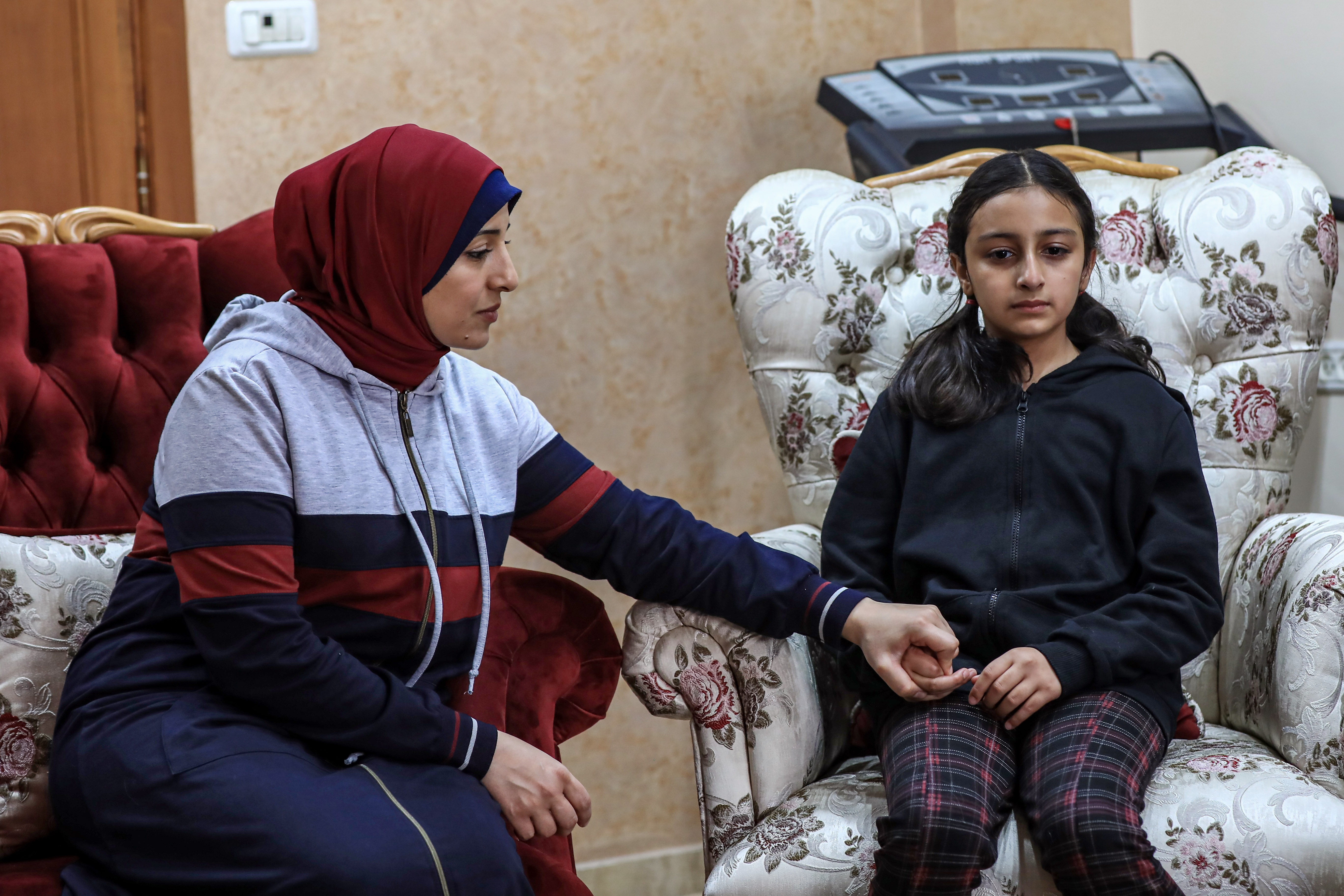 A mother tries to assure her daughter. 