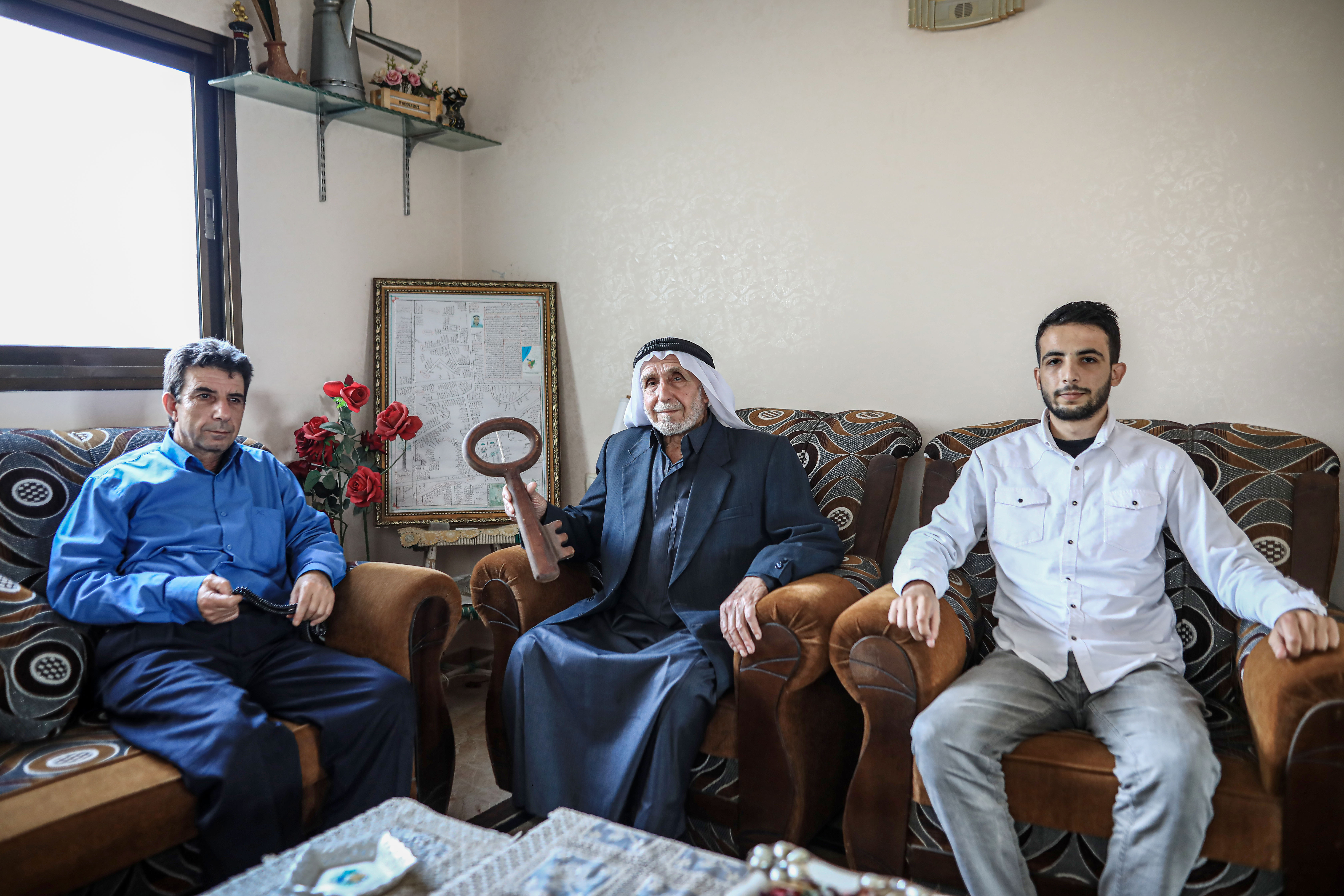 The al-Kilani son, grandfather and grandson, in their home in the al-Sabra neighbourhood east of Gaza