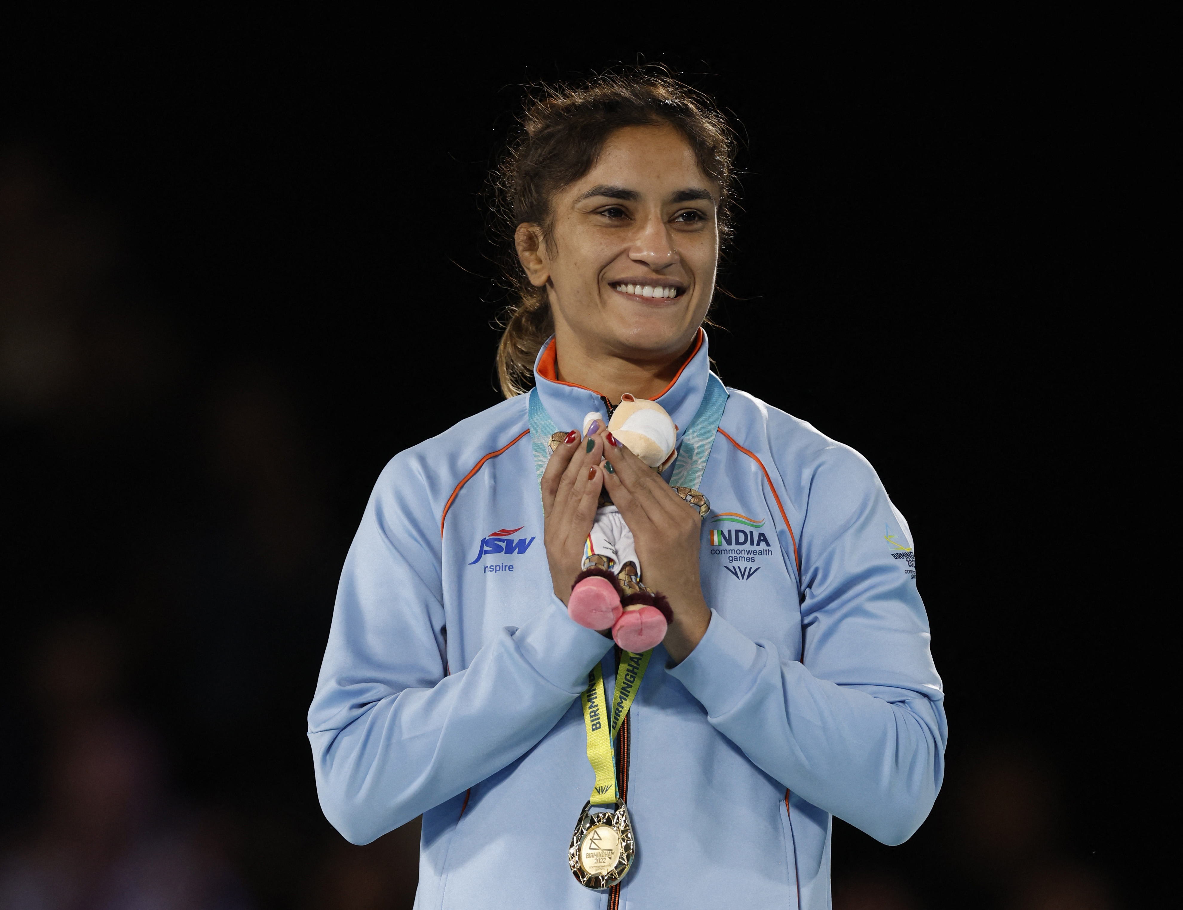 India's Vinesh Phogat celebrates with the gold medal 