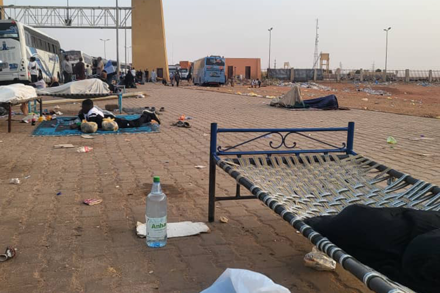 Makawi rented a bedframe for her parents to alternate on at night. The gate to the Argeen border can be seen in front, April 25, 2023 [Courtesy Tibyan Farid]