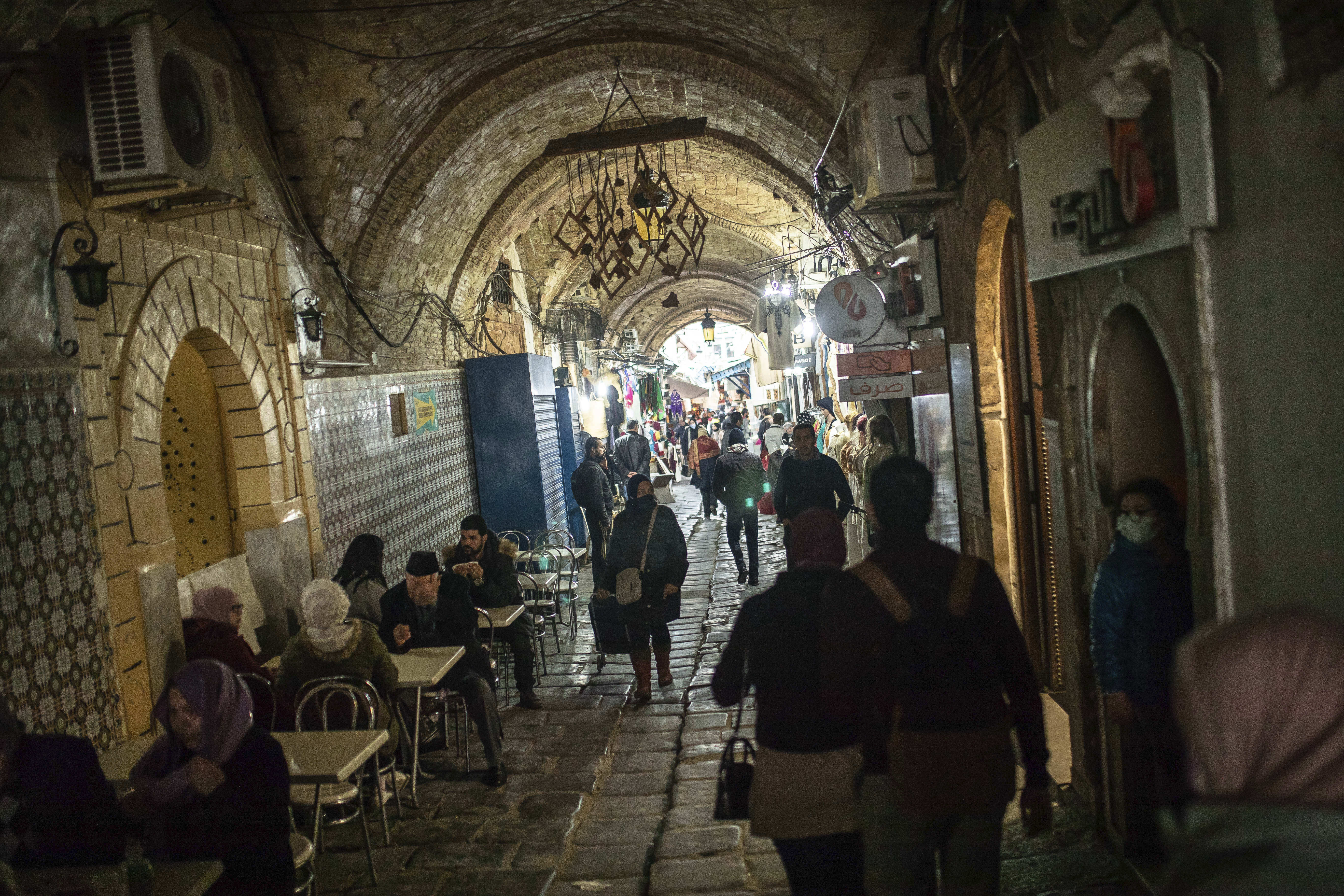 People walk in the Old Medina of Tunis, Tunisia, on January 13, 2021