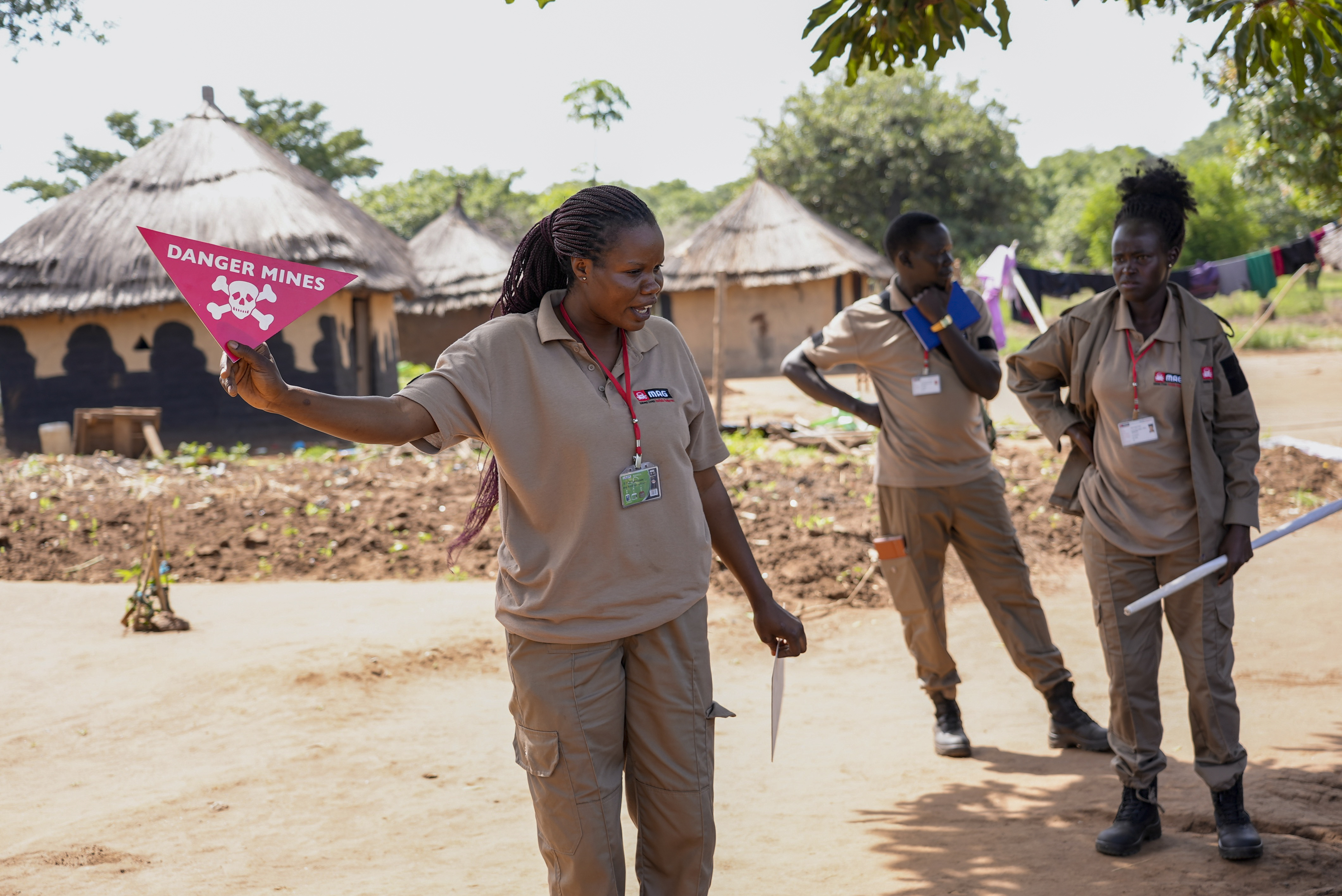 Staff from the Mines Advisory Group (MAG) teach children about the risks of unexploded mines