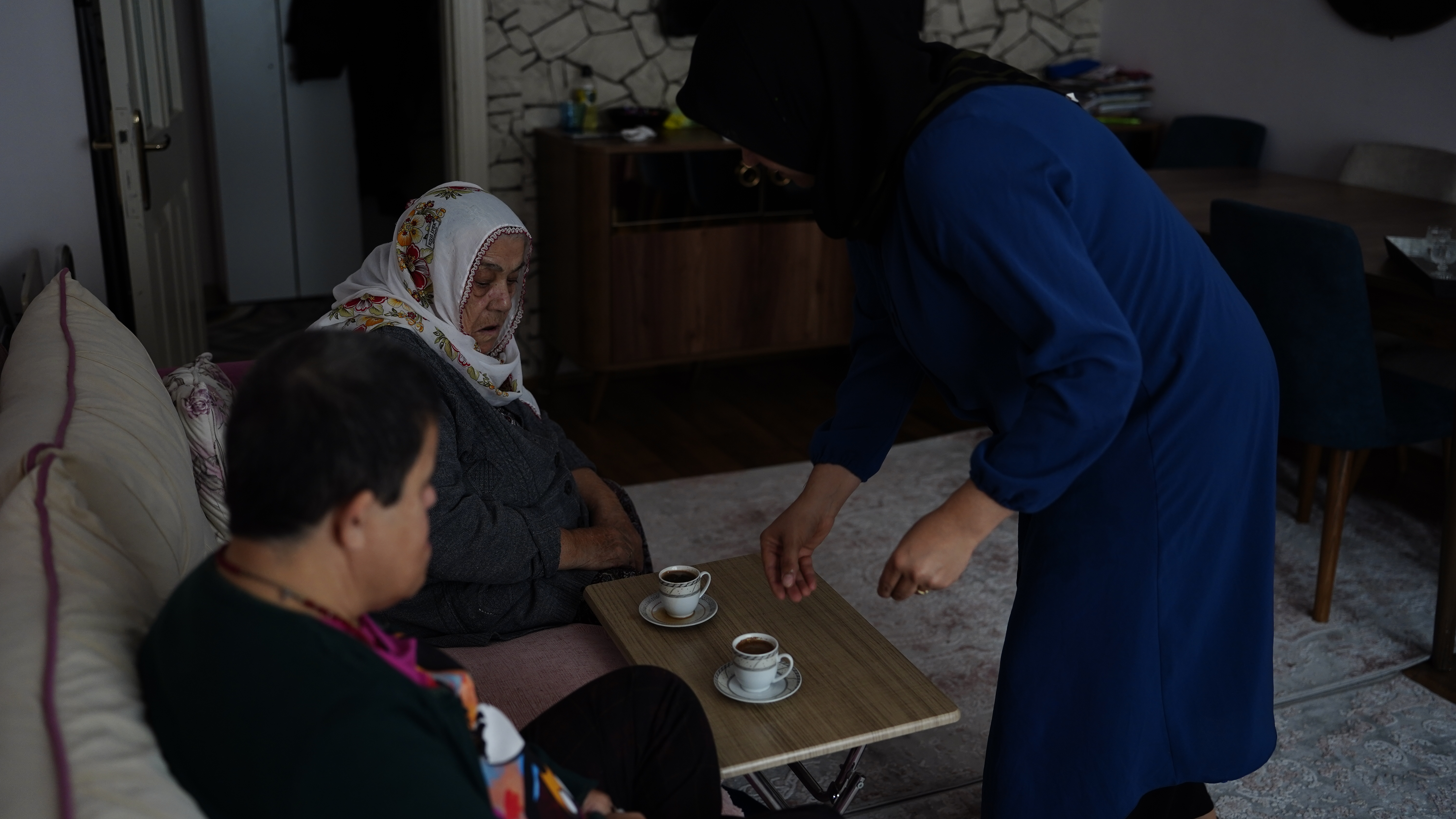 Latife at home, serving Turkish coffee to Mesude and Ikbal