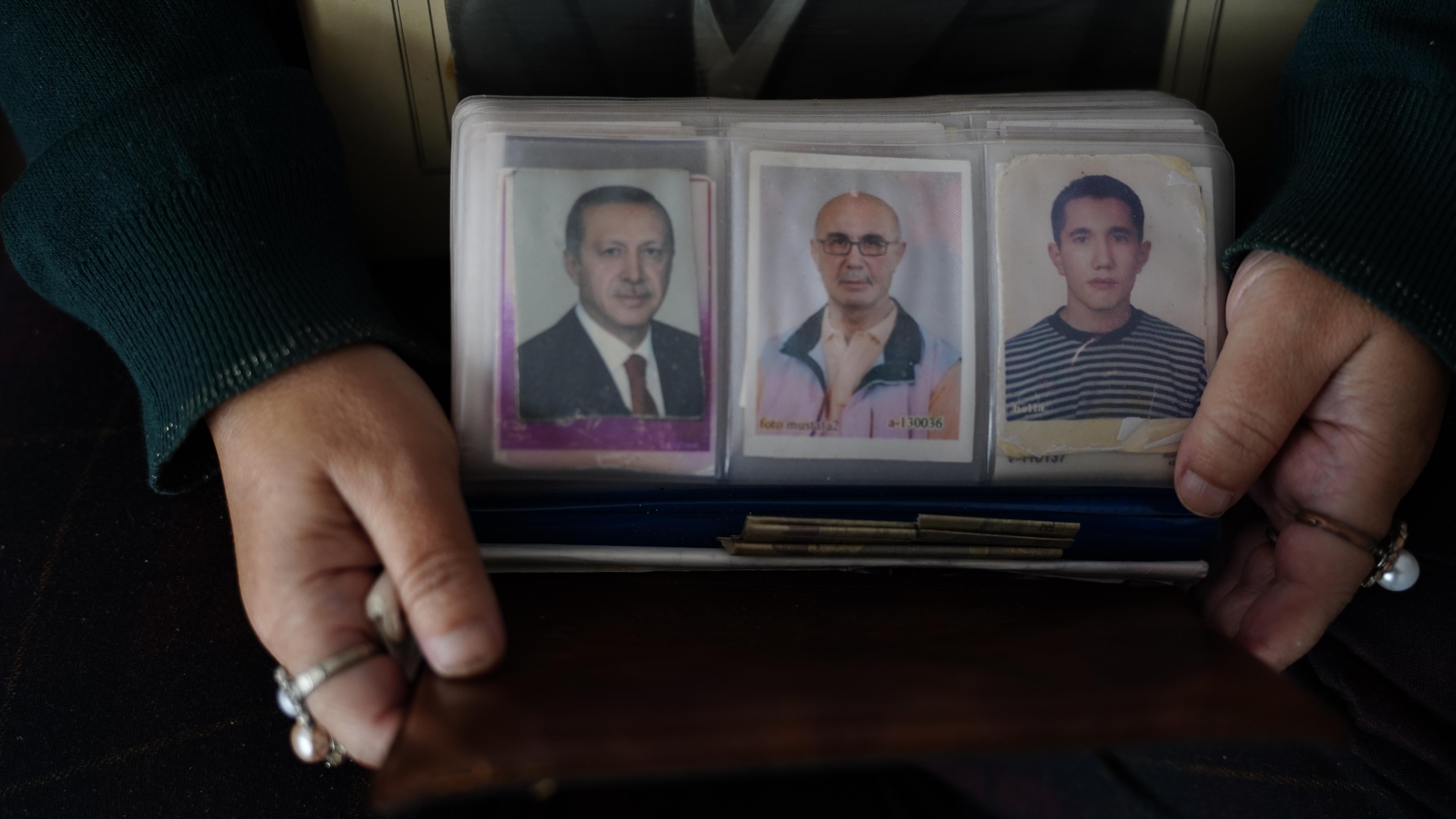 Mesude loves collecting headshots of people and has a prized collection of hundreds of neatly arranged headshots - including one of Turkish President Recep Tayyip Erdogan [Courtesy of Durmus Bayram]