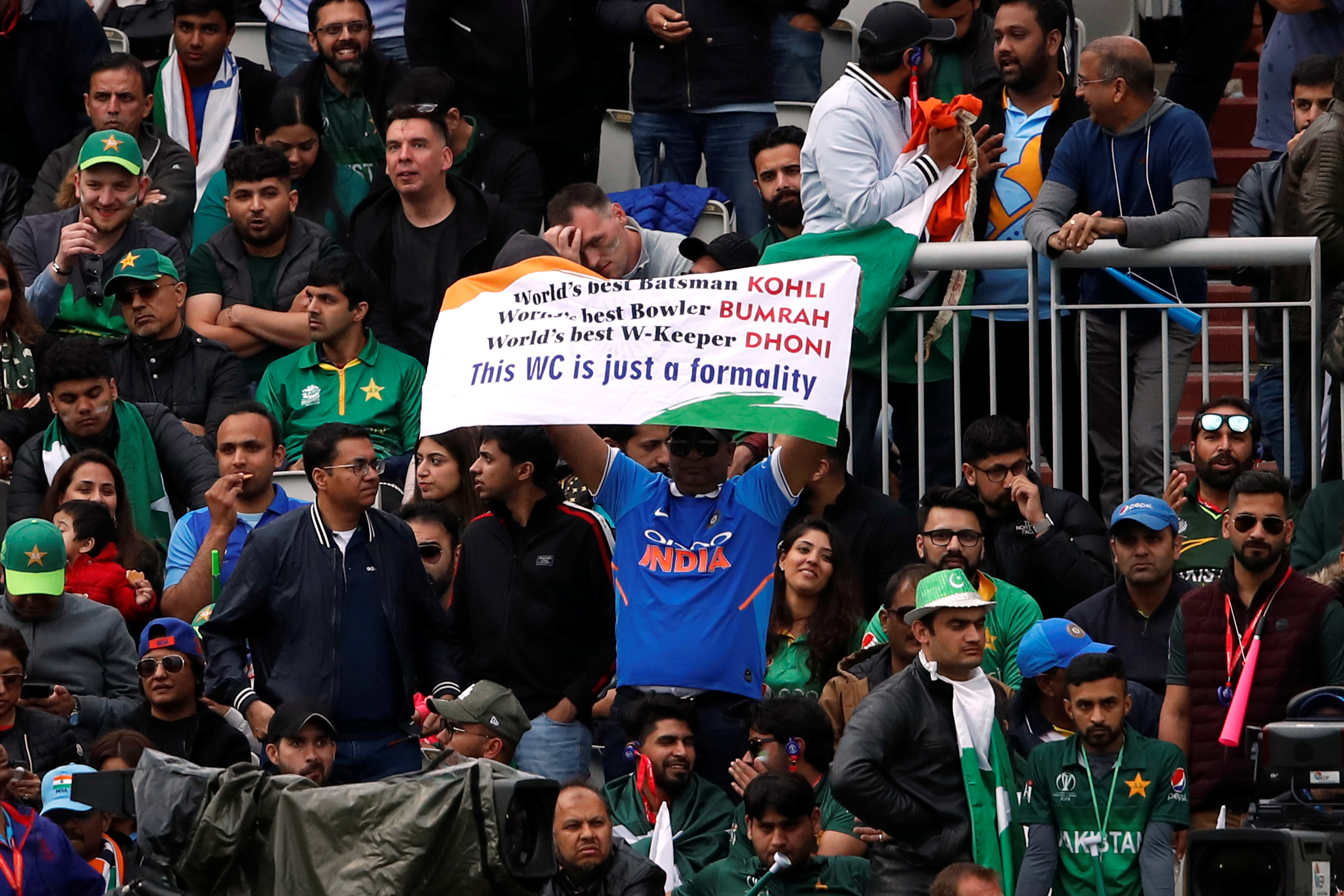 An India fan holds up a banner during the match