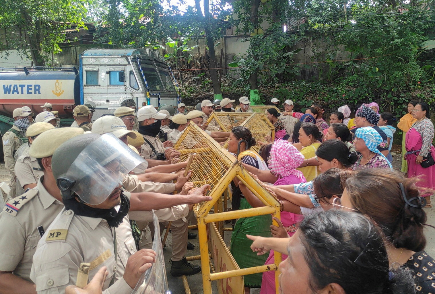 Supporters of Rahul Gandhi, a senior leader of India's main opposition Congress party, try to break through a police barricade after his convoy heading to Churachandpur was stopped by police in Bishnupur, northeastern state of Manipur, India