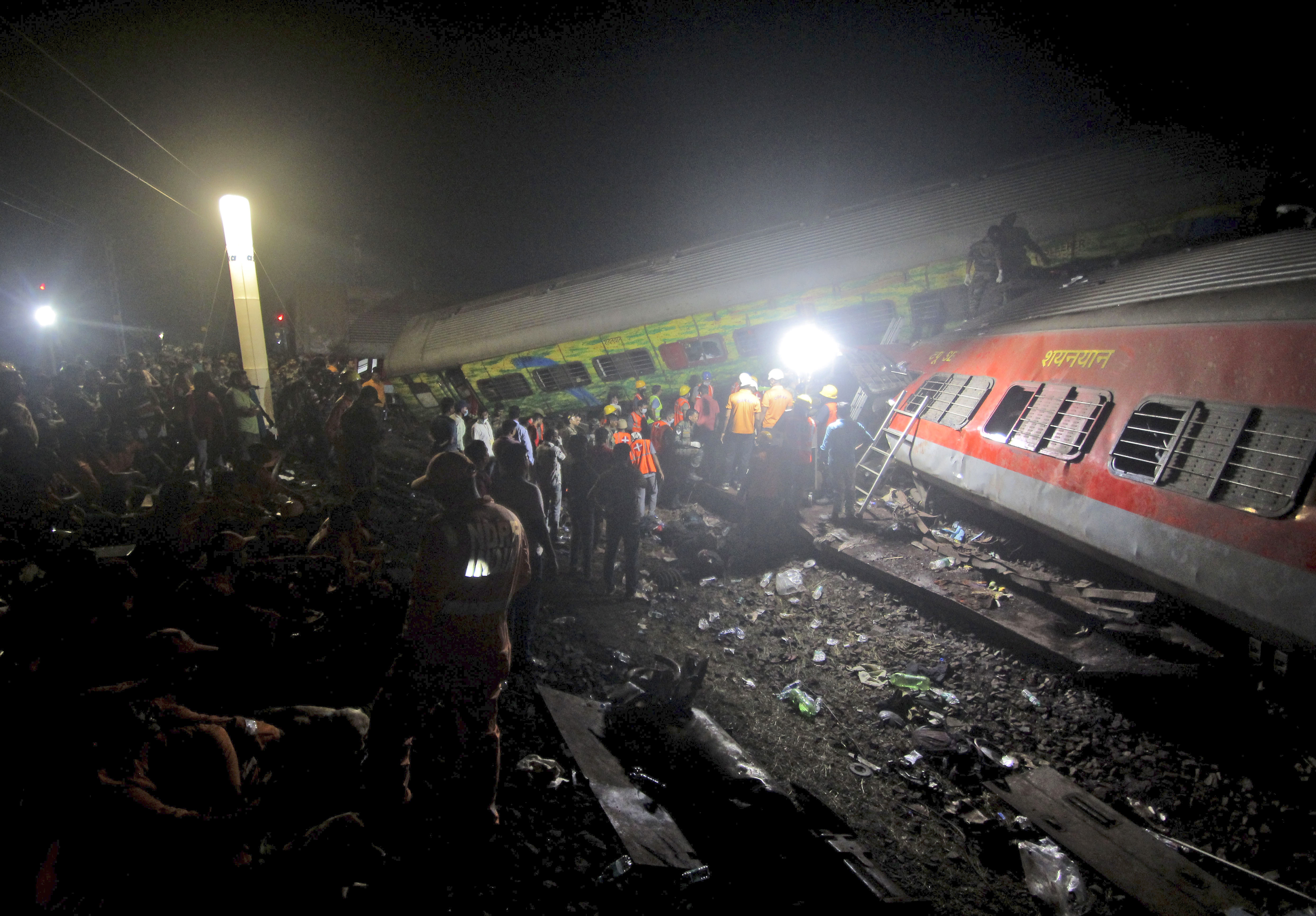 Rescuers work at the site of passenger trains accident in Balasore district