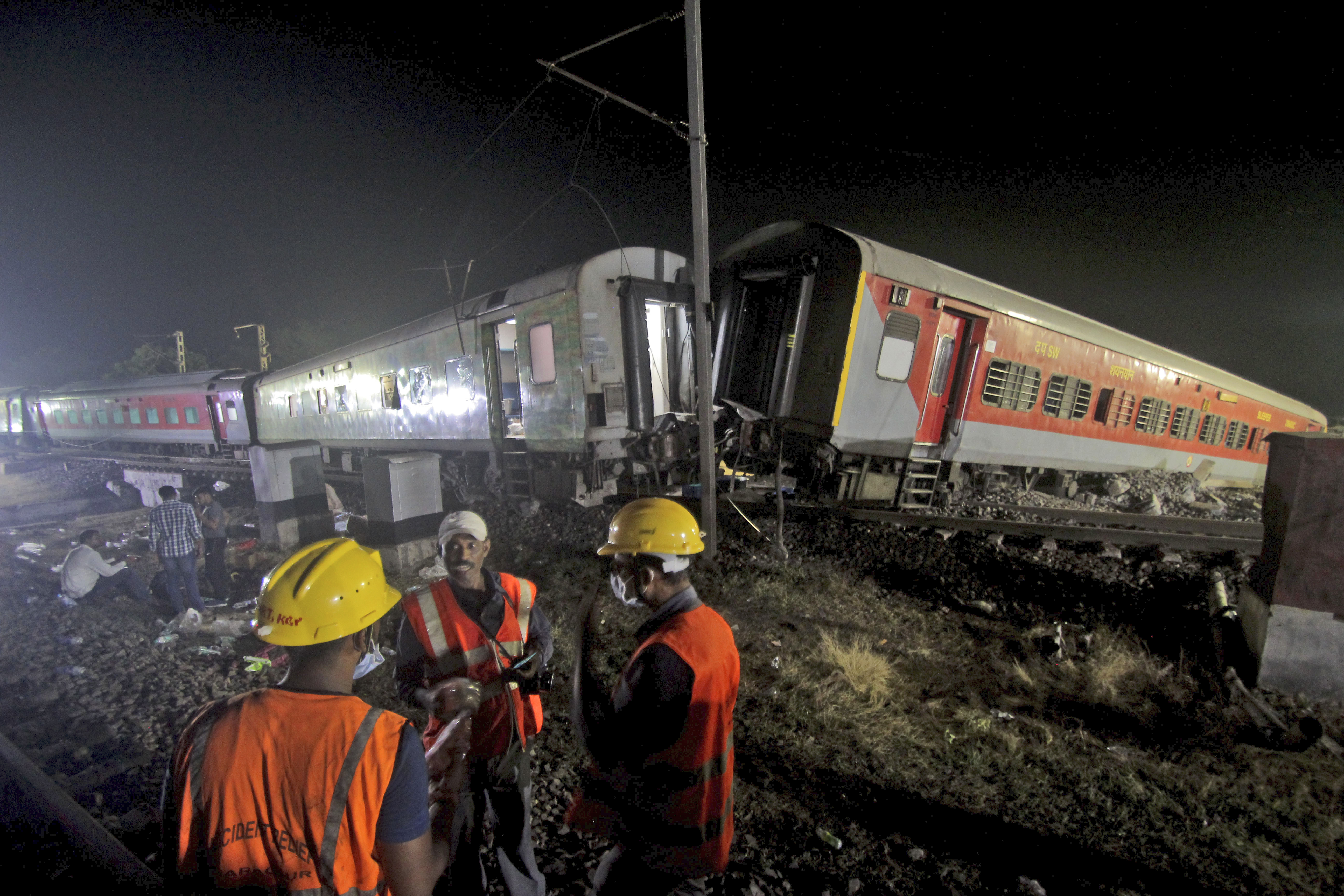 Rescuers work at the site of passenger trains accident in Balasore district