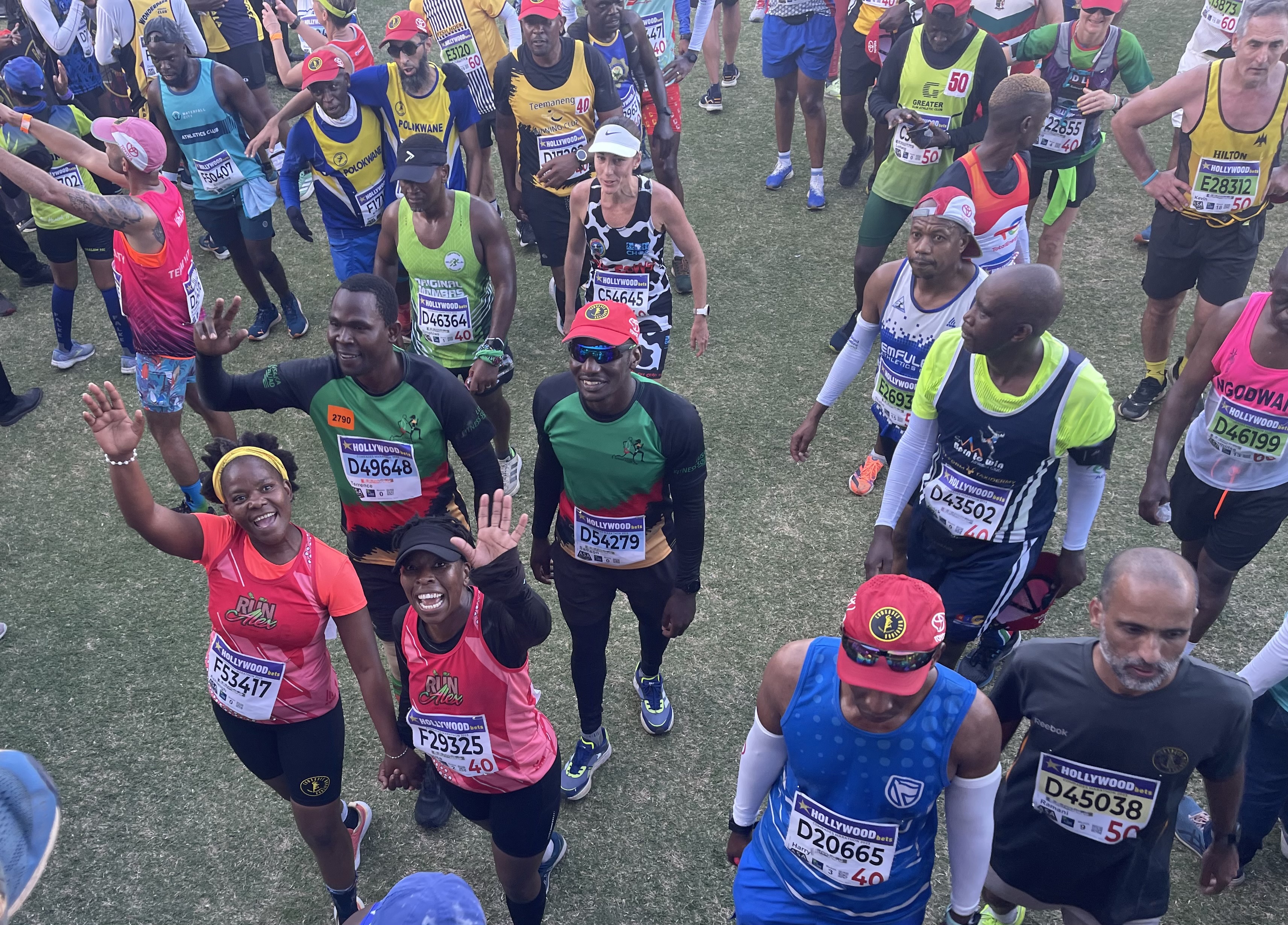 Ashleigh Adams (in pink, left) on the finish line of the 2023 Comrades Marathon in Durban, South Africa.
