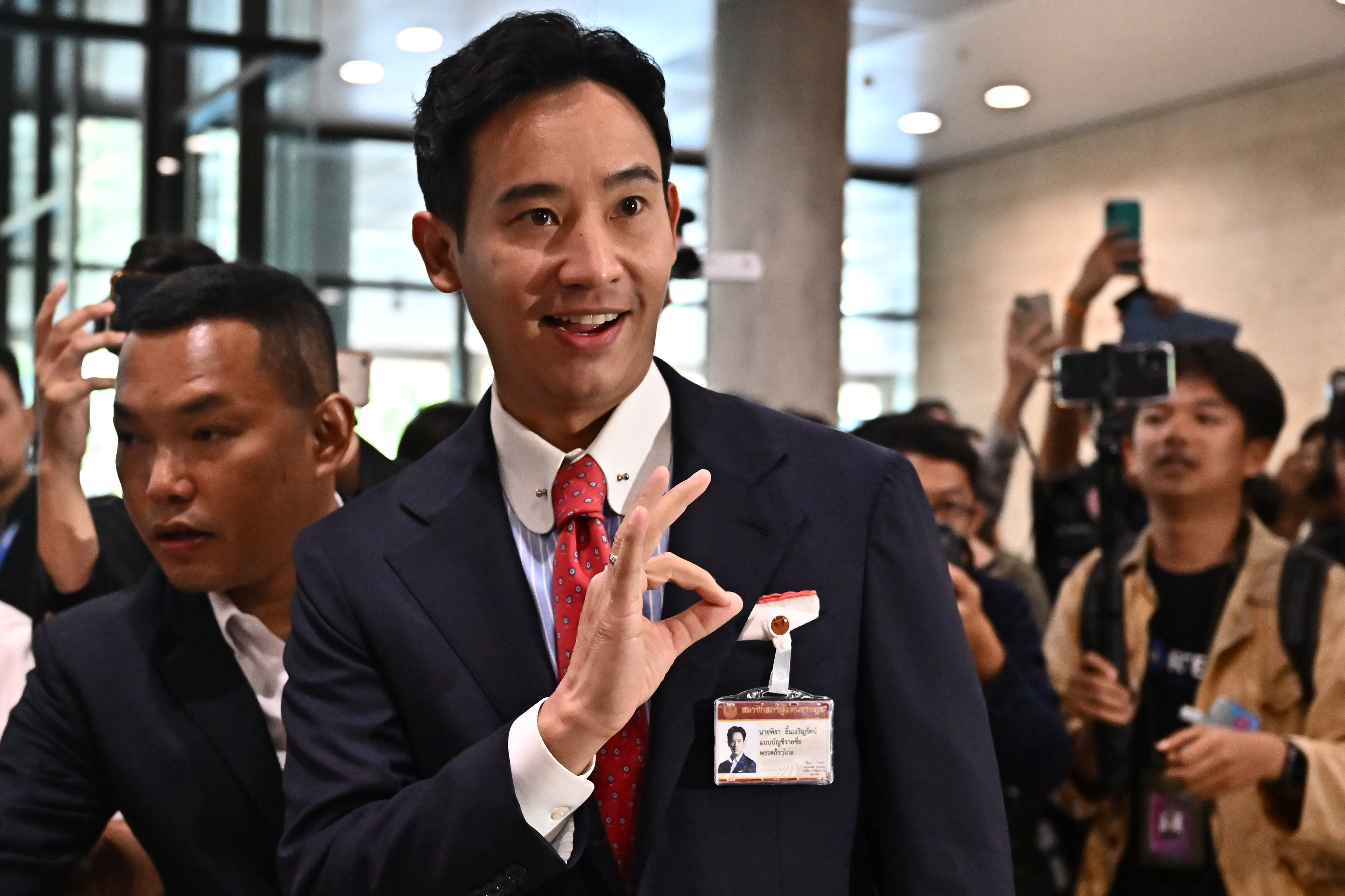 Move Forward Party Leader and prime minister candidate Pita Limjaroenrat gestures as he arrives at the Thai Parliament before the parliamentary vote for the premiership in Bangkok on July 13, 2023.