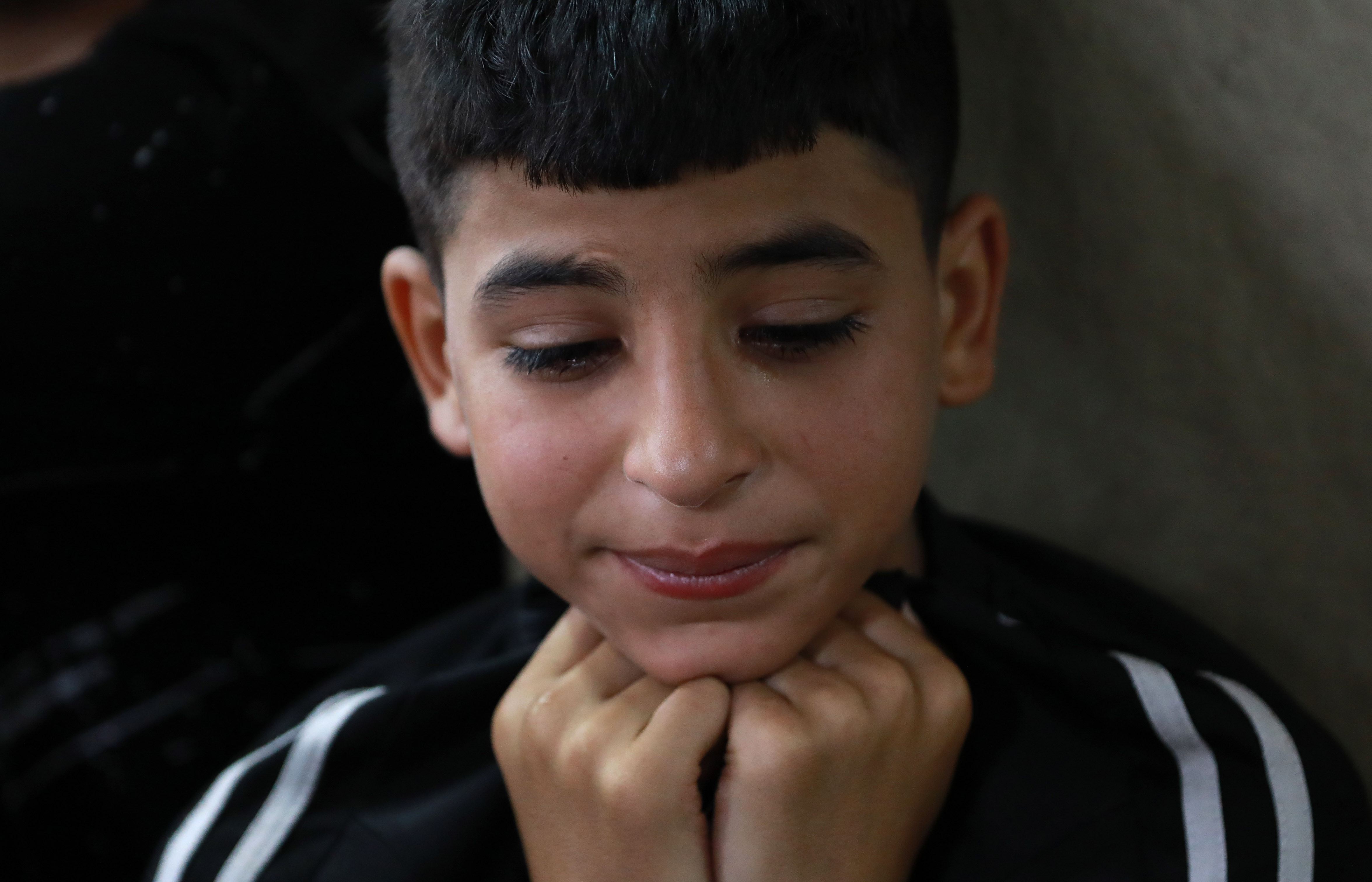 One of the mourners at Faris Abu Samra’s funeral
