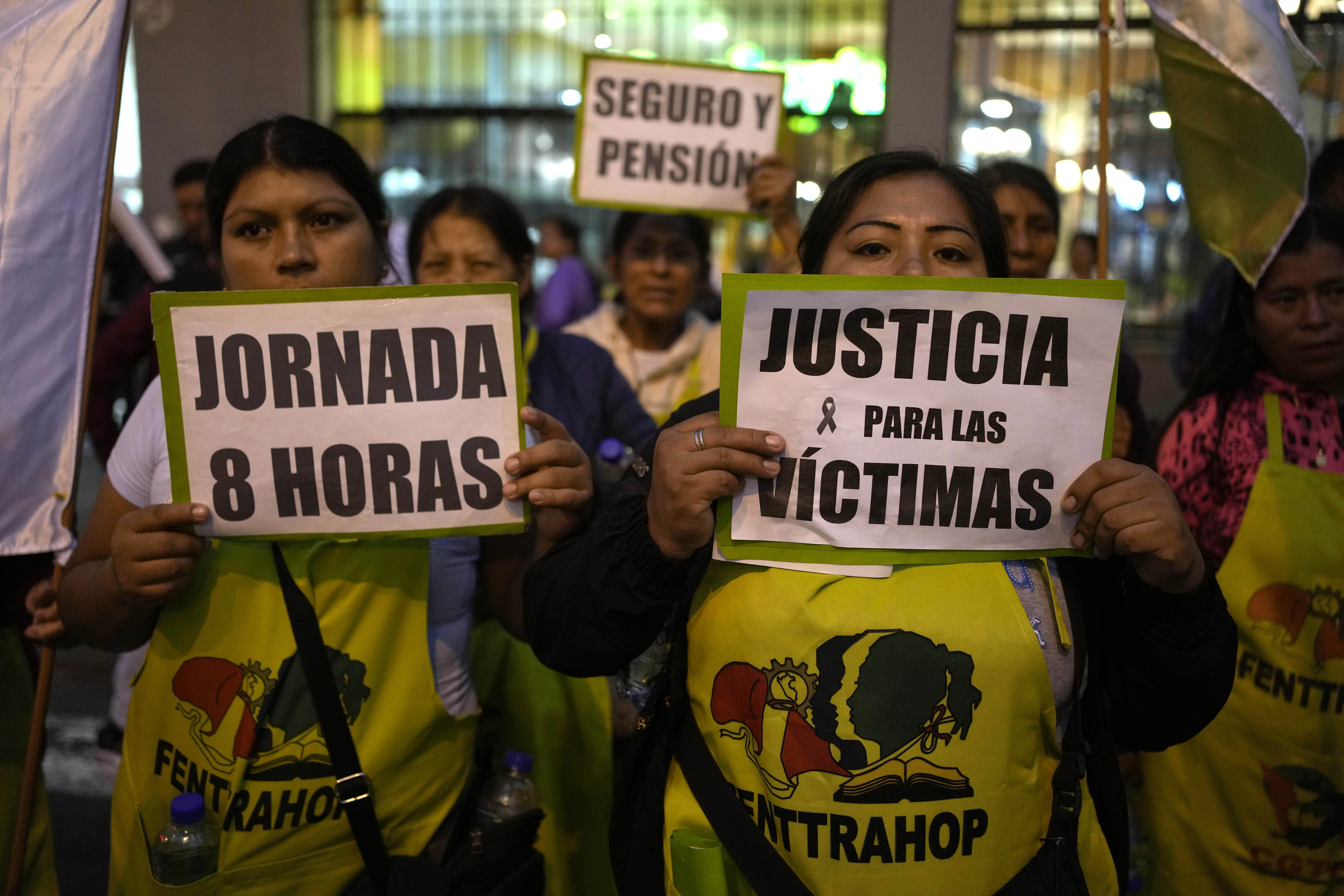 Demonstrators gather in front of the Congress building in Lima, Peru, on June 14 to call for justice for those killed in recent anti-government protests, among other things