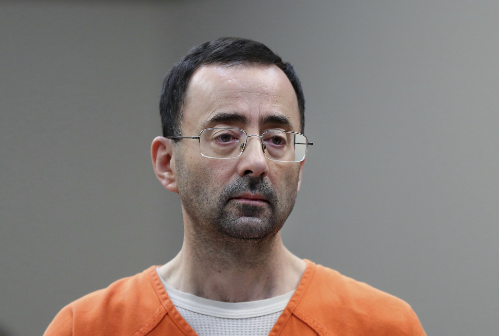 Larry Nassar in an orange jumpsuit