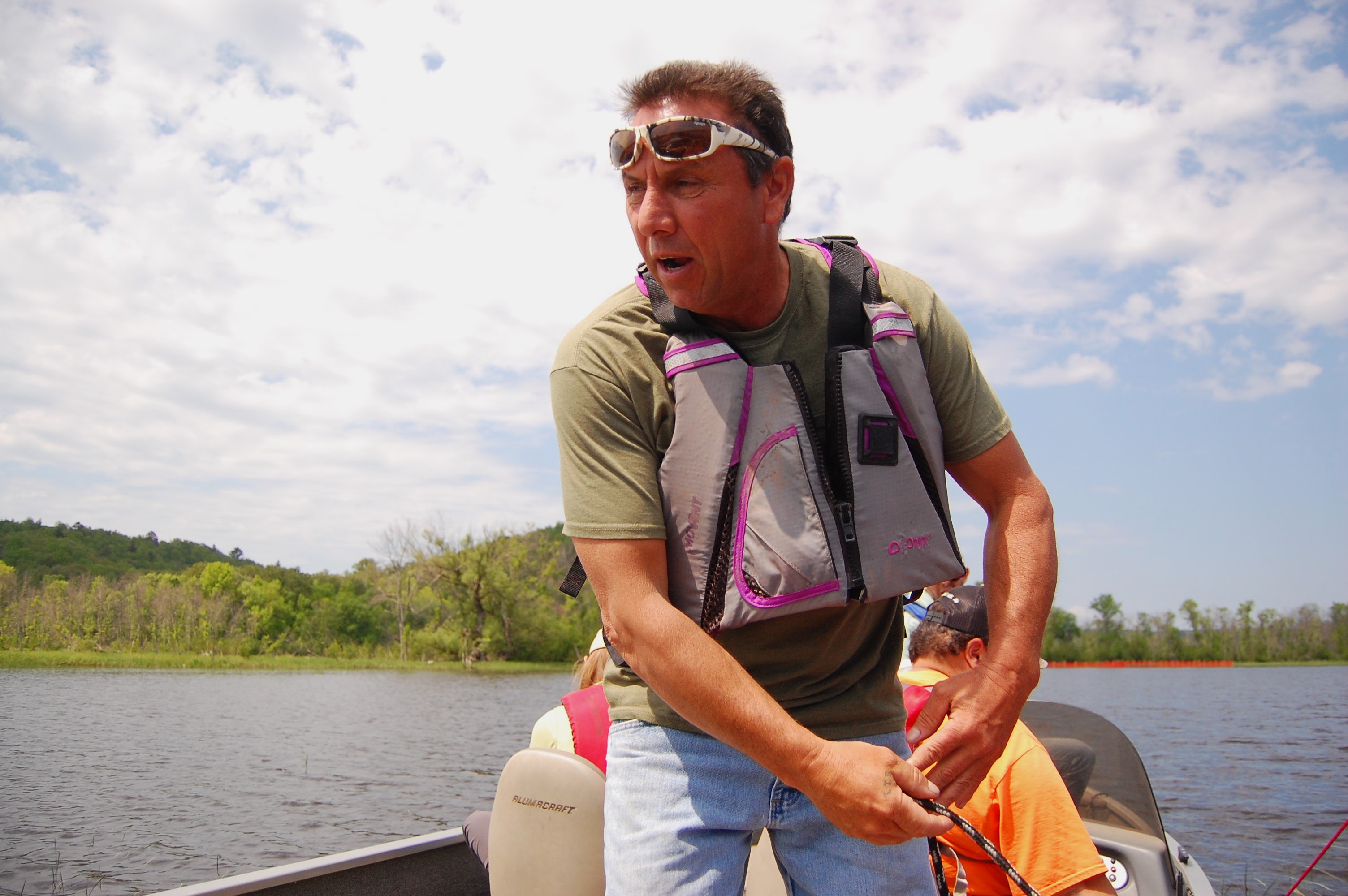 Terry Perrault, lead technician in the natural resources department at Fond du Lac Band of Lake Superior Chippewa, speaks about wild rice from a boat on the St Louis River, Minnesota, US