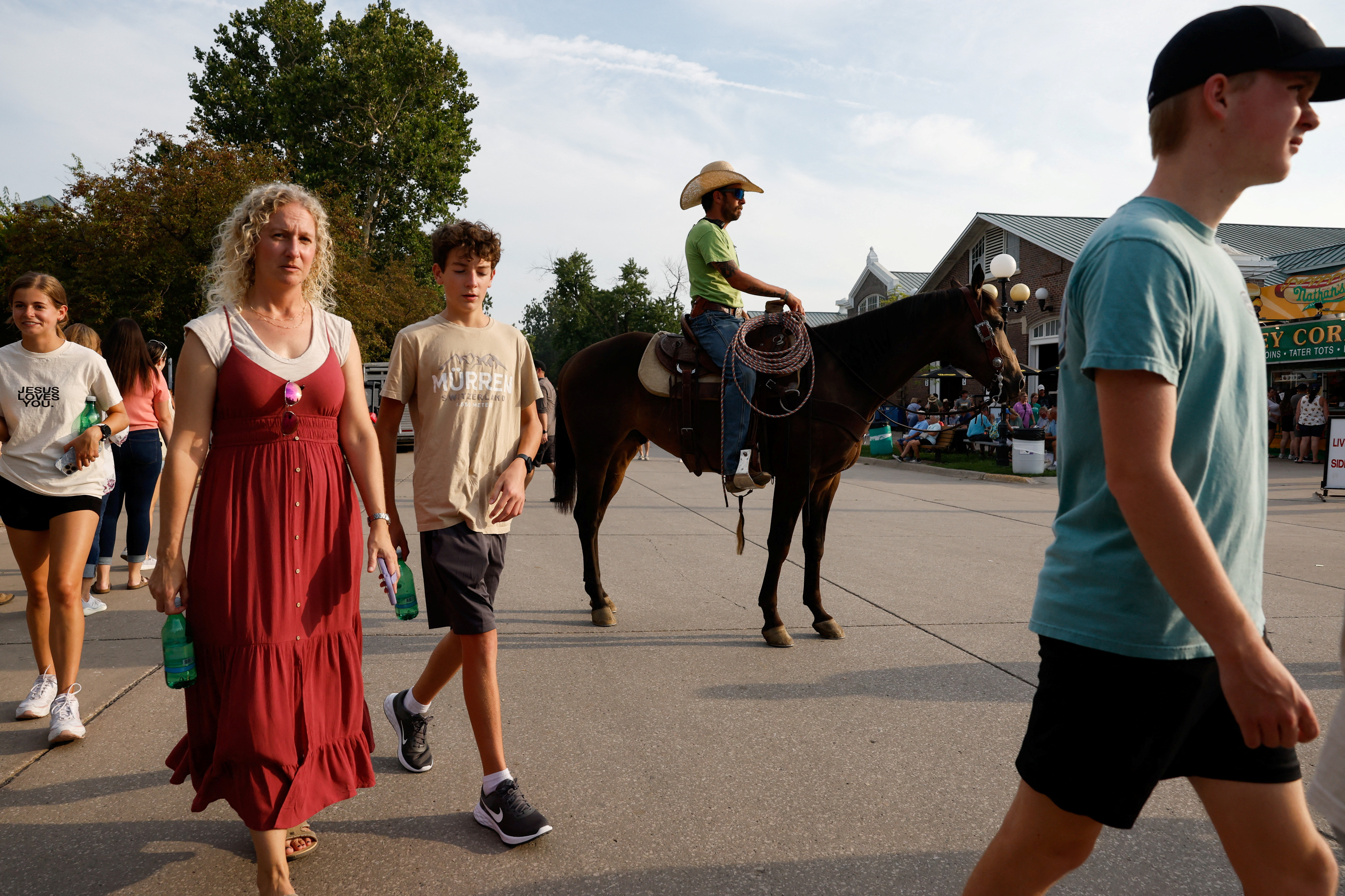 A Livestock Control worker rides a horse around the Iowa State Fair in Des Moines, Iowa, U.S. August 10, 2023.