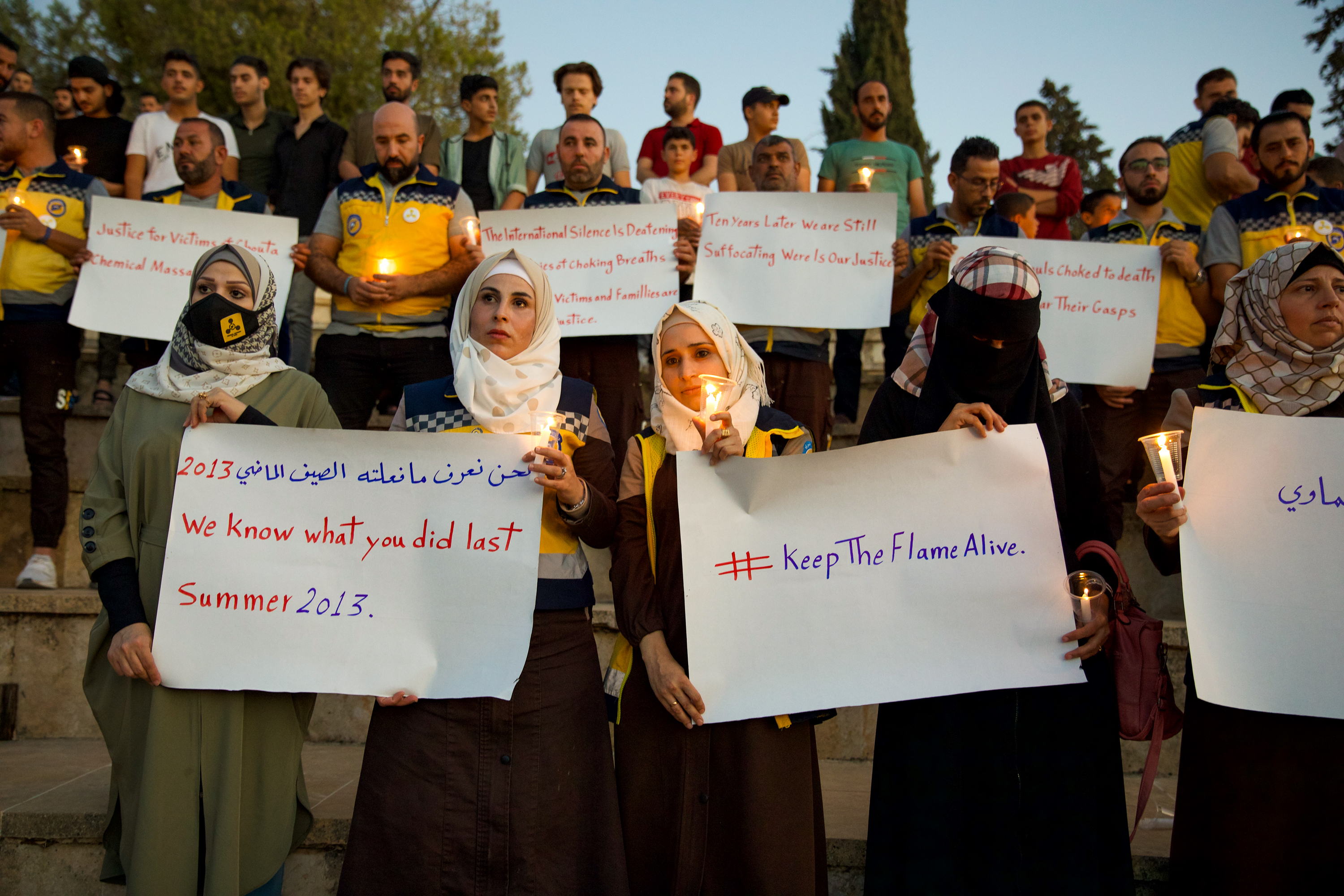Activists and members of the Syrian White Helmets commemorate the 10th anniversary of the Eastern Ghouta attacks on August 20, 2023, in Idlib, northwest Syria