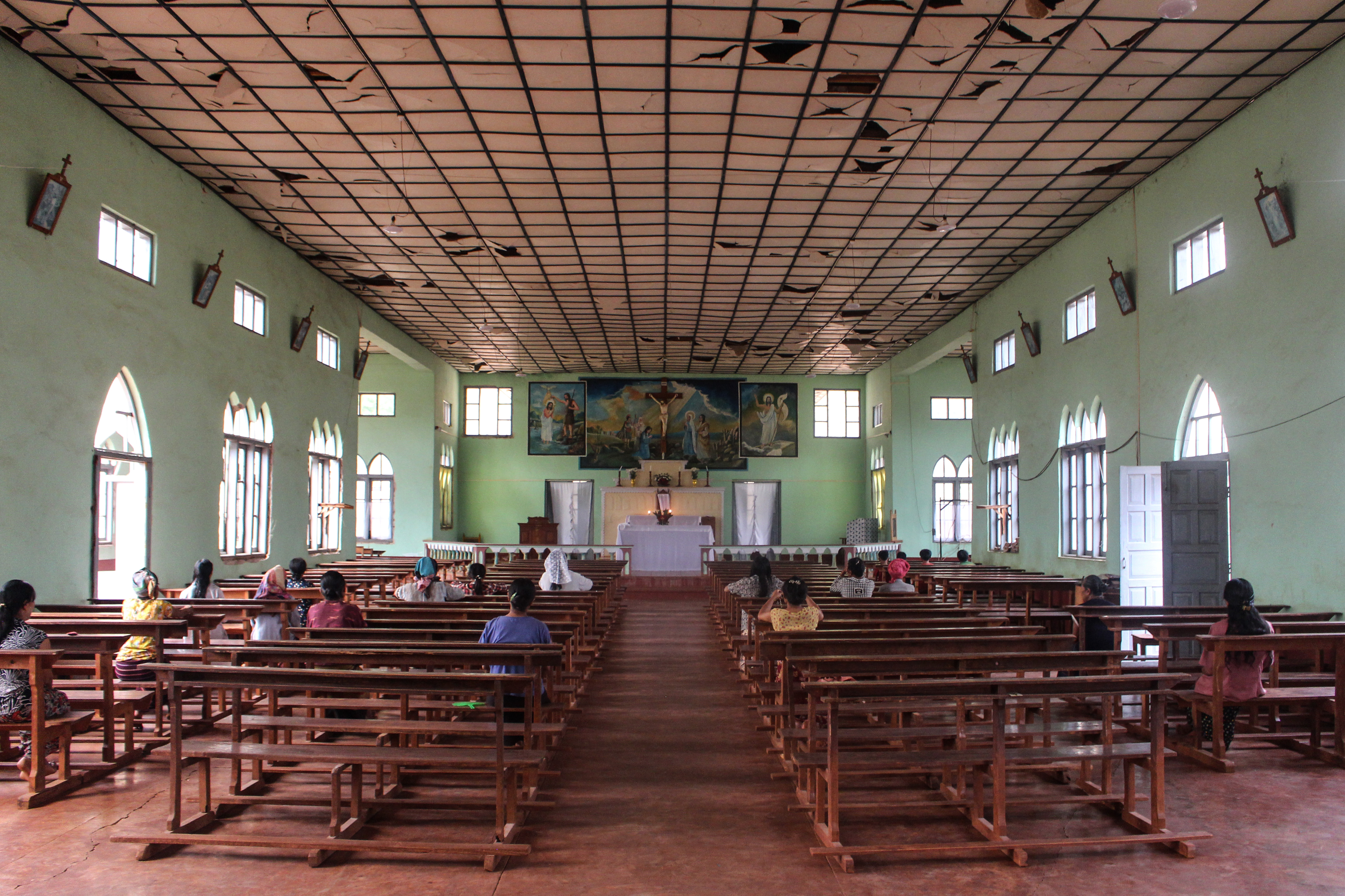 Worshippers gather at a bomb-damaged church in Demoso township, Kayah state, Myanmar