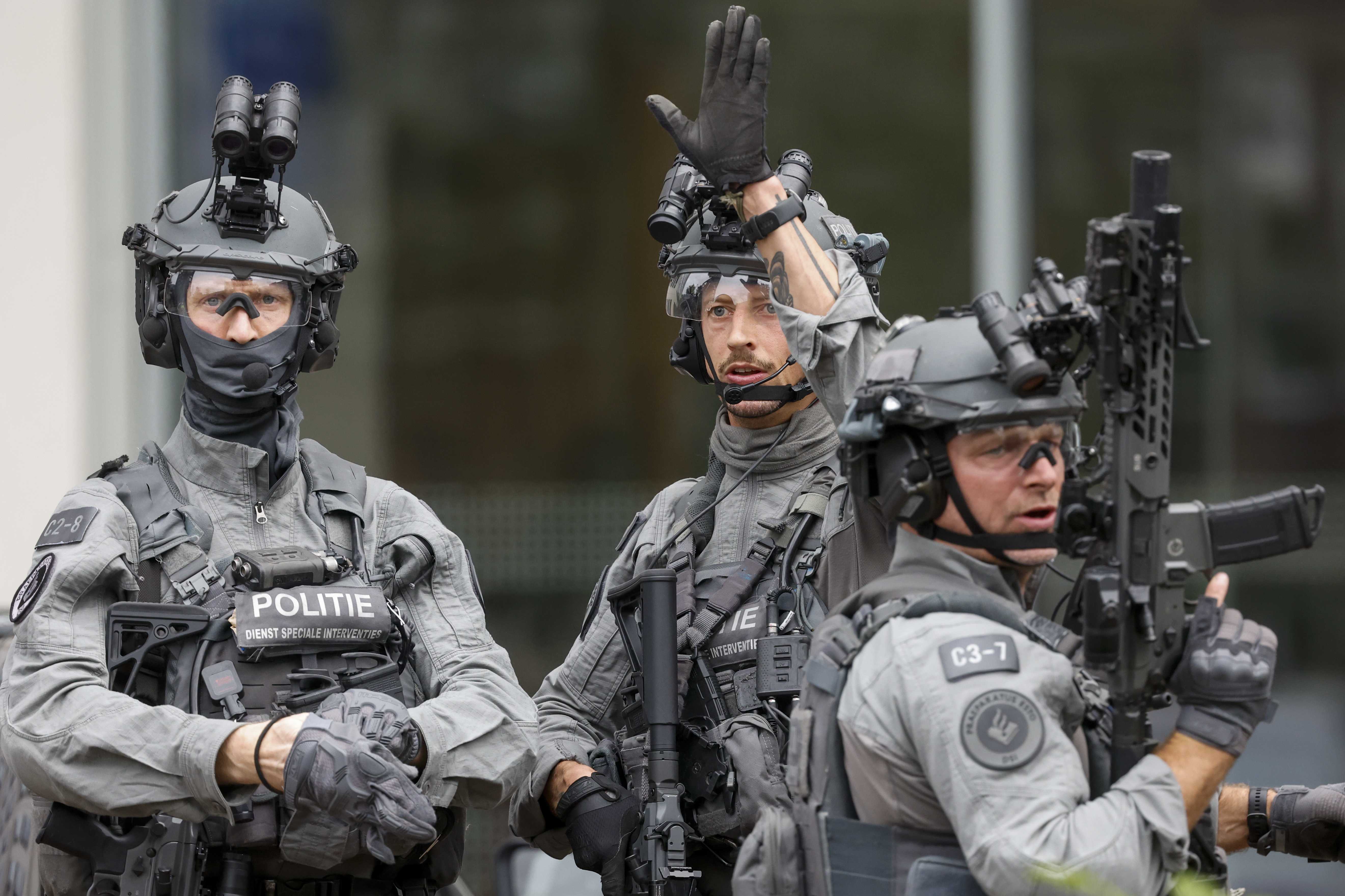 Police officers from the special intervention service stand outside the Erasmus MC Rotterdam hospital on Rochussenstraat, which has been cordoned off after two shooting incidents in Rotterdam, Netherlands