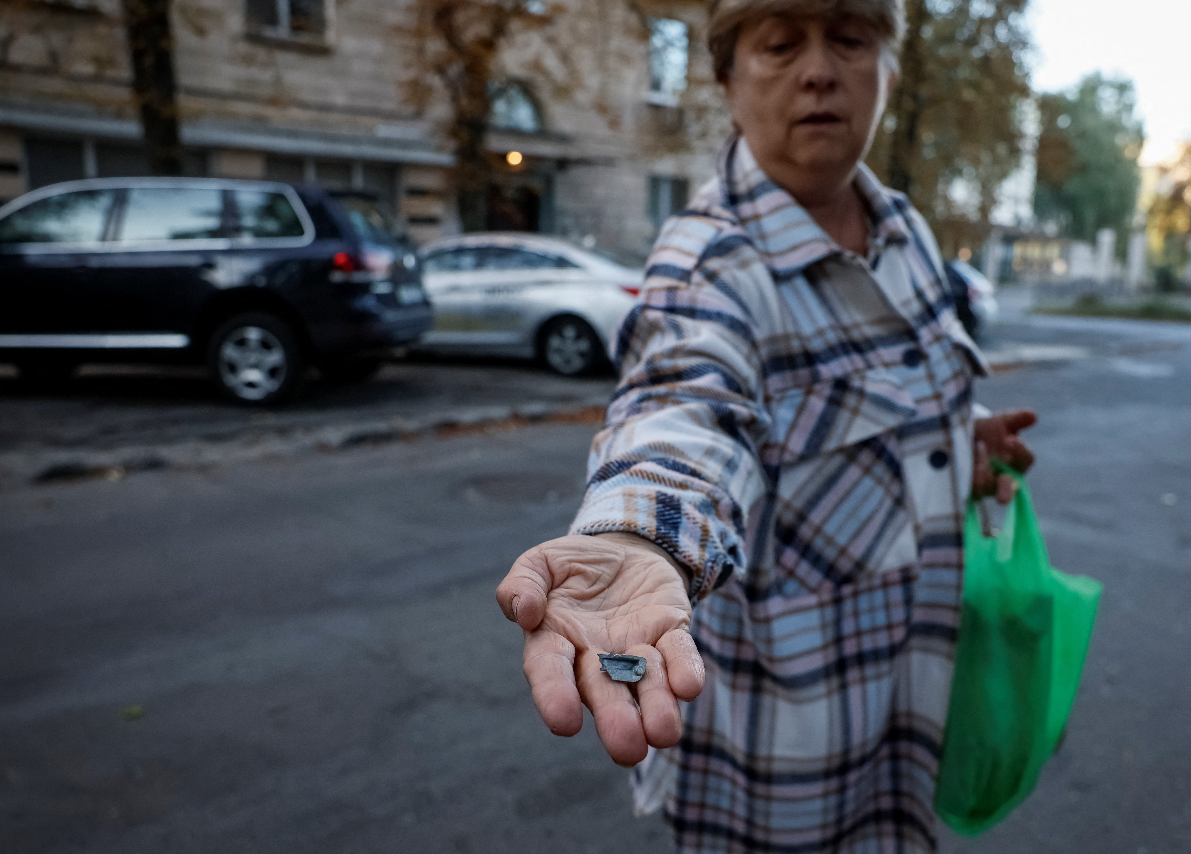 A local resident Lyudmila, 65, shows the splinter that hit her apartment during a Russian drone strike, amid Russia's attack on Ukraine, in Kyiv, Ukraine September 10, 2023. REUTERS/Gleb Garanich