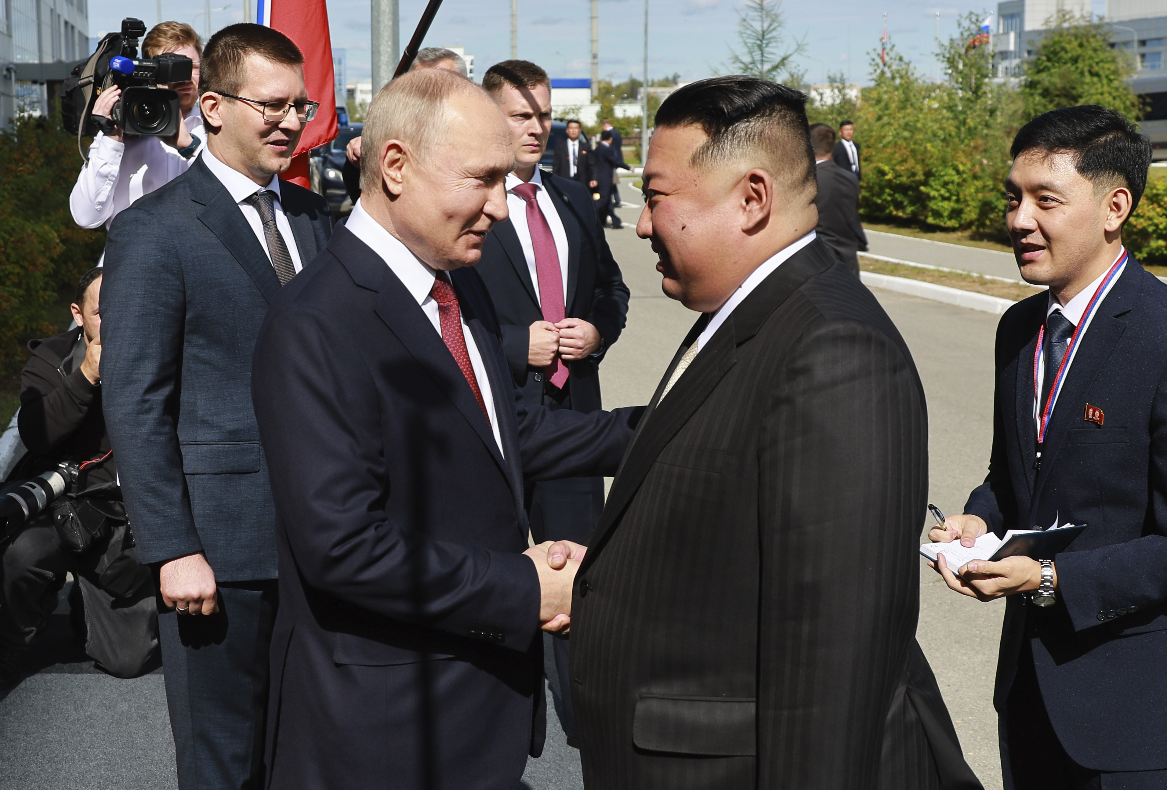 Russian President Vladimir Putin, left, and North Korea's leader Kim Jong Un shake hands during their meeting at the Vostochny cosmodrome outside the city of Tsiolkovsky,