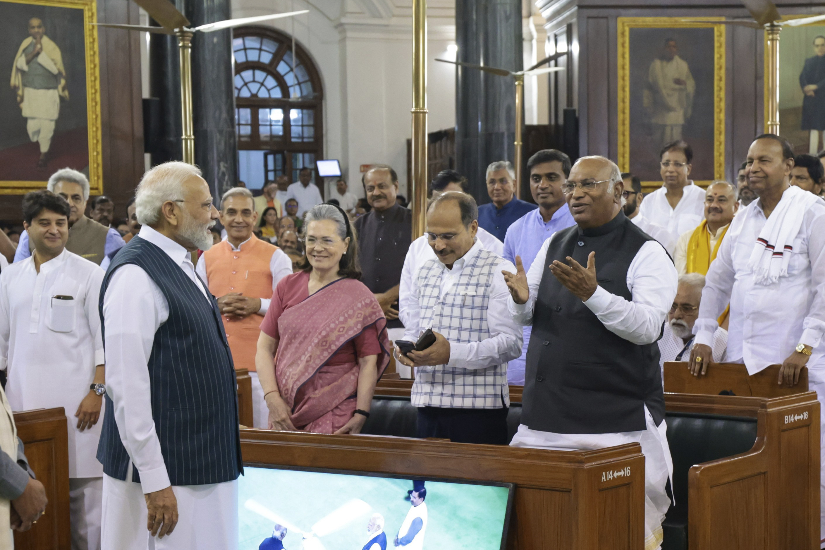 Modi talking to Congress president Mallikarjun Kharge, right, with former president Sonia Gandhi and Adhir Ranjan Chowdhury at the central hall of the old parliament building [Press Information Bureau via AP]