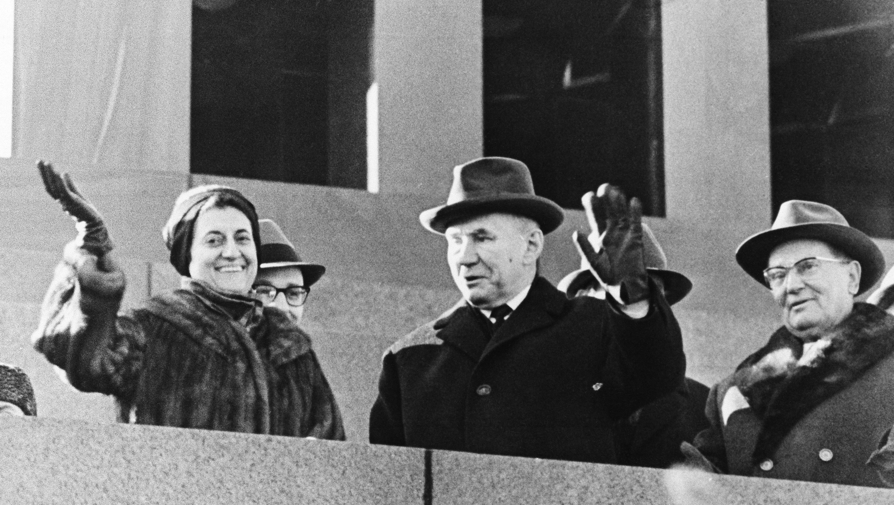 Mrs. Indira Gandhi, the Indian Prime Minister, and Yugoslav President Josip Broz Tito flank Soviet Premier Alexei Kosygin on stand atop Lenins Mausoleum as they watch huge parade in Moscows Red Square on Nov. 7, 1967. Occasion was the 50th anniversary of the Bolshevik Revolution. (AP Photo)