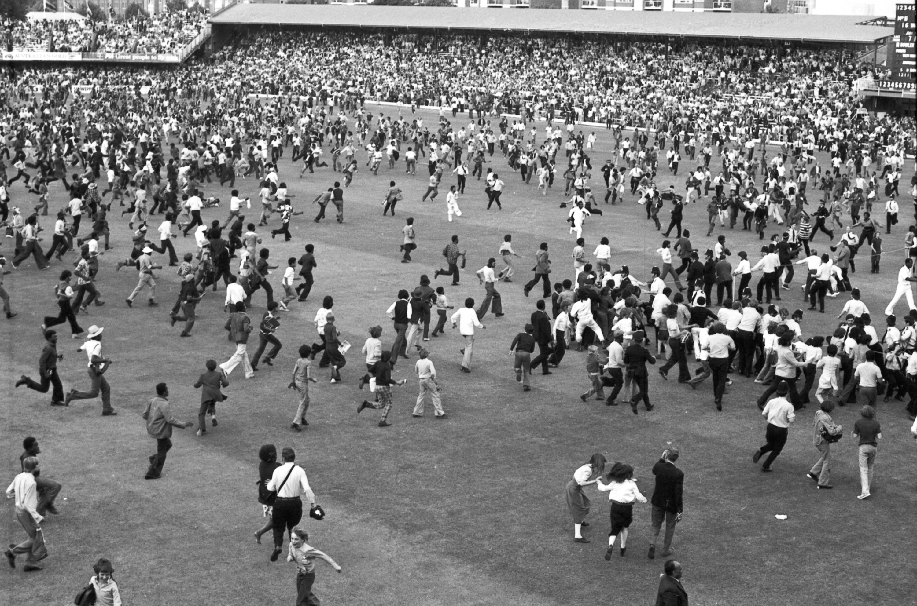 West Indies fans race across the Lord's Cricket Ground, London, June 21, 1975, to congratulate their team after they had beaten the Australians in the final of the Prudential World Cup cricket match, by 17 runs.