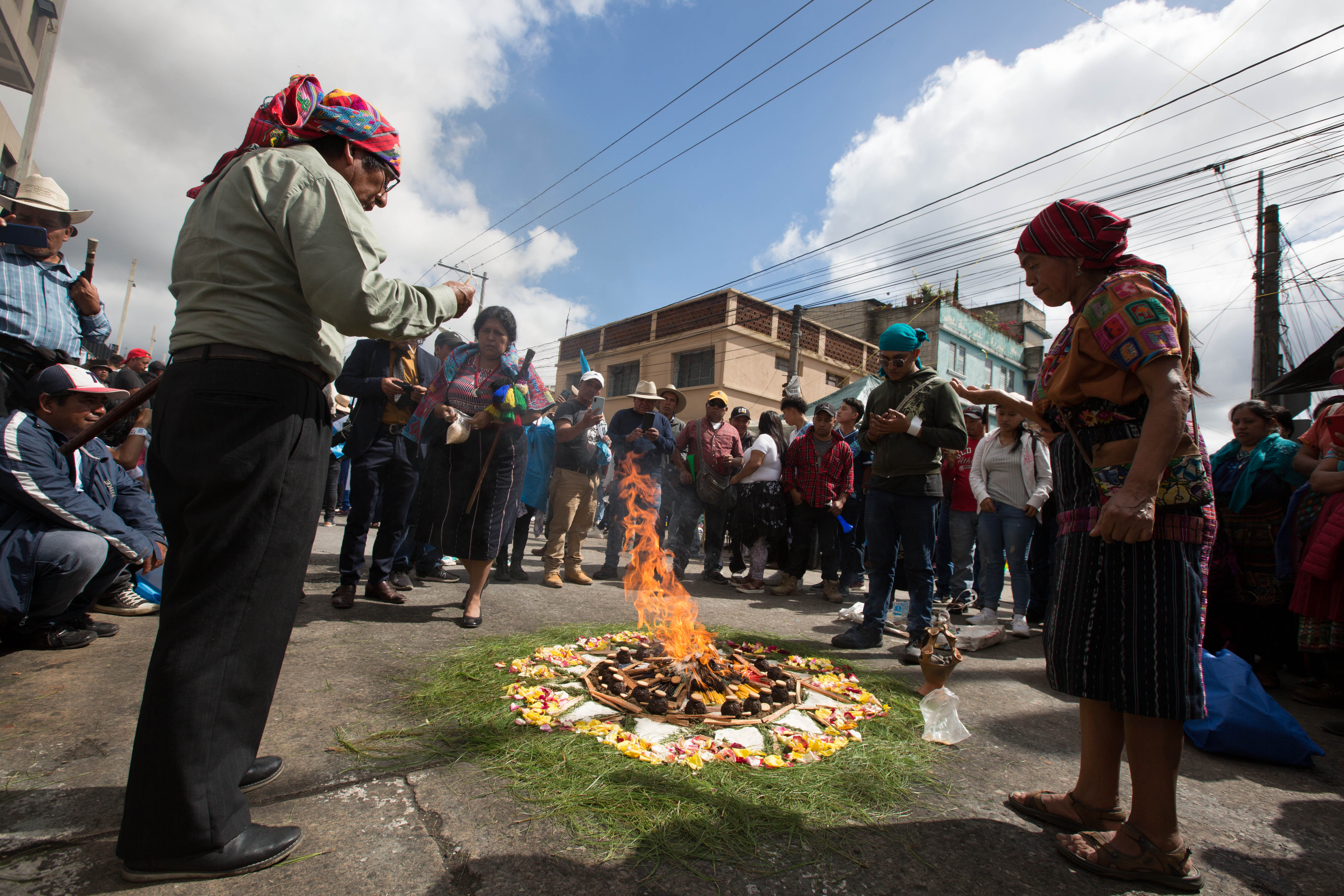 Spiritual guides light ceremonial fires as they call for accountability in the political crisis that has accompanied Guatemala’s presidential elections