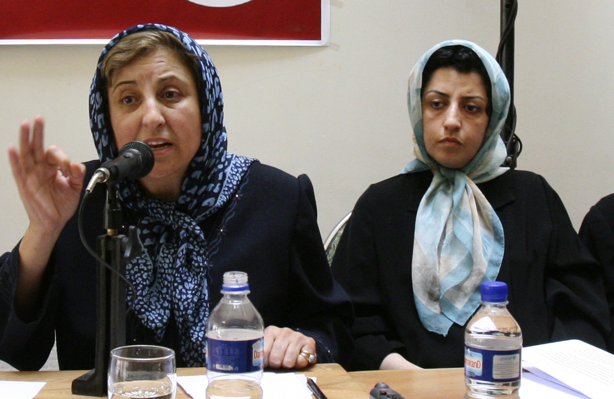Prominent Iranian human rights activist Narges Mohammadi, right, listens to Iranian Nobel Peace Prize laureate Shirin Ebadi while attending a meeting on women’s rights in Tehran, Iran, on August 27, 2007