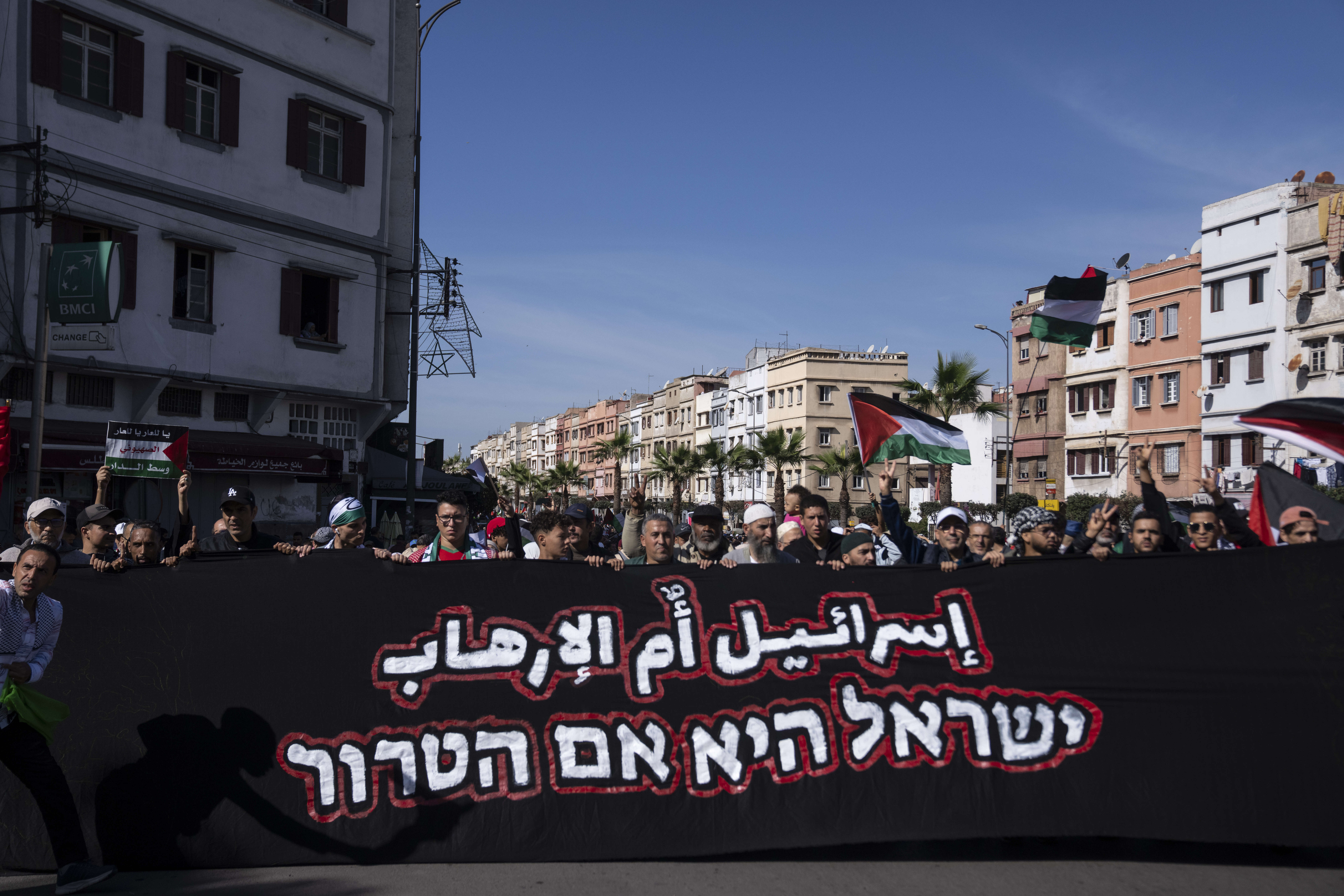 Thousands Moroccans take part in a protest in solidarity with Palestinians in Gaza and against normalisation with Israel, in Casablanca, Morocco, Sunday, Oct. 29, 2023. Banner in Arabic reads "Israel is the mother of terrorism"