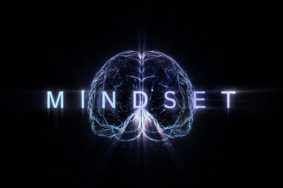 An image of an illustrated illuminated brain with the words MINDSET in front of a black background.