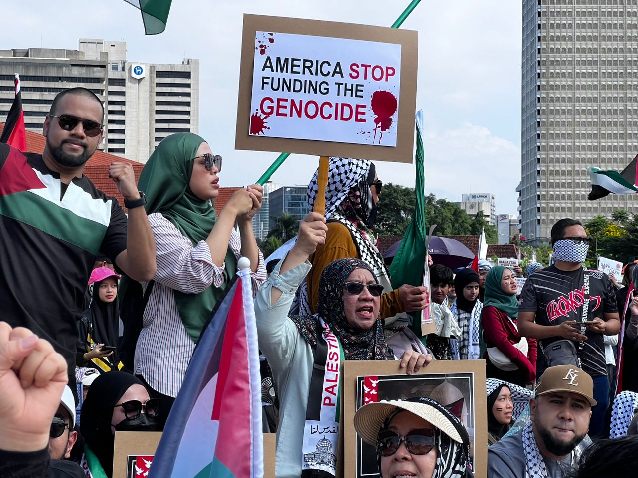 Malaysian protesters have called on the US to end its funding of the Israeli military