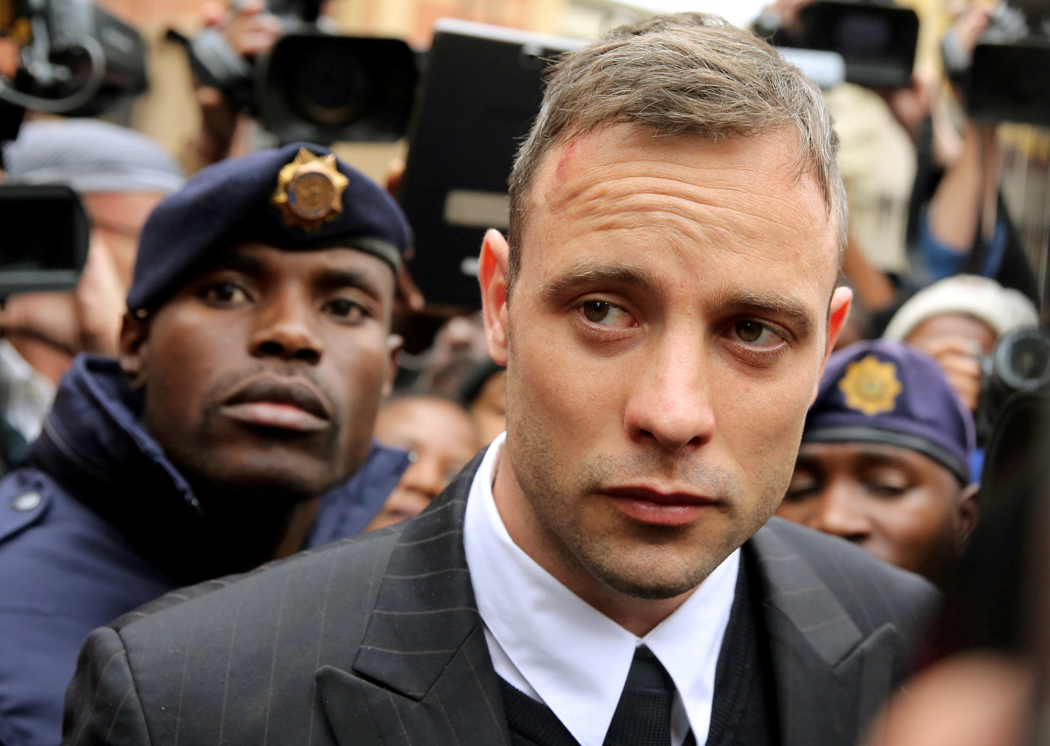 Olympic and Paralympic track star Oscar Pistorius leaves court