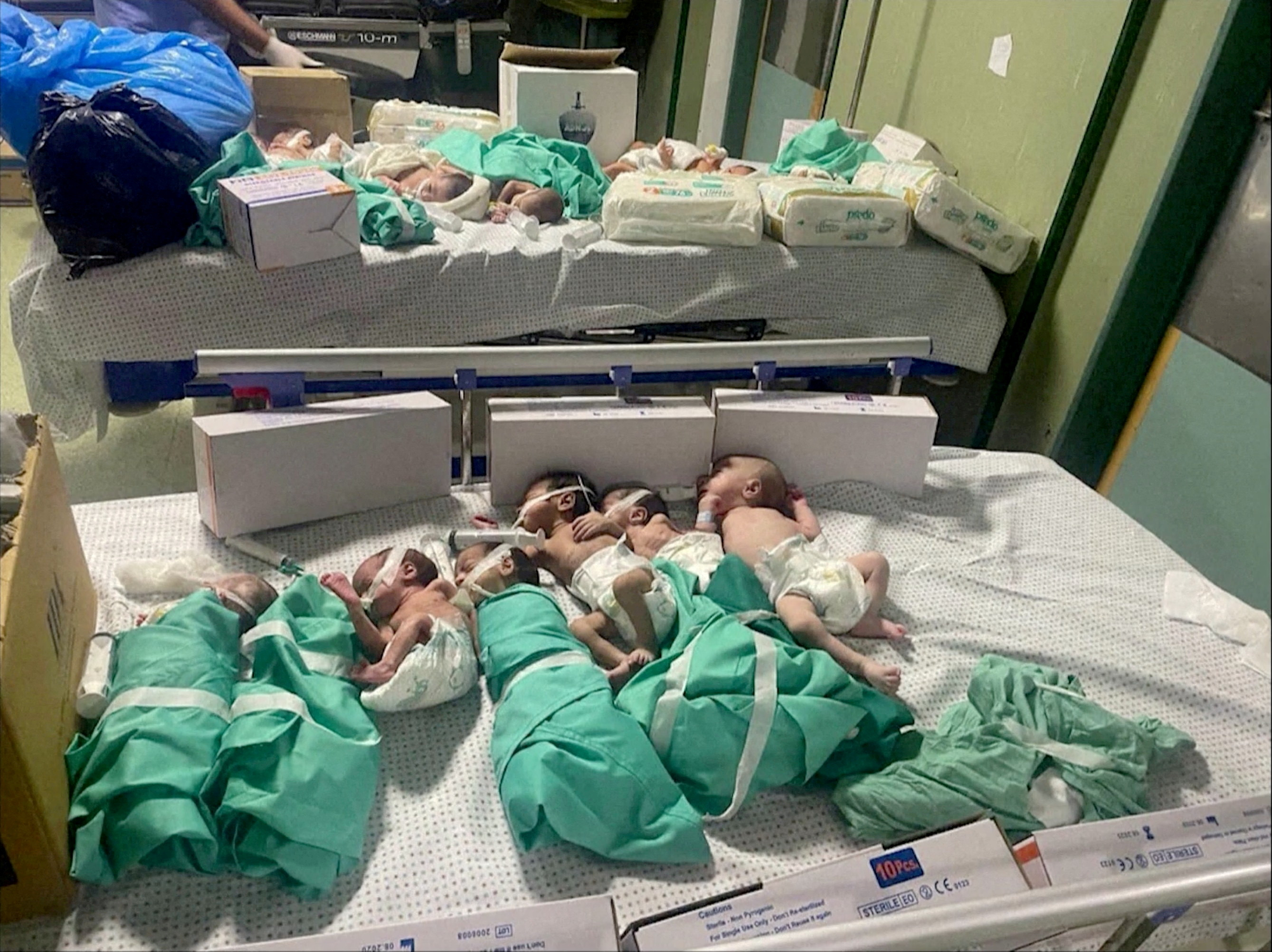 Newborns are placed in bed after being taken off incubators in Gaza's Al Shifa hospital after power outage, amid the ongoing conflict between Israel and the Palestinian Islamist group Hamas, in Gaza City