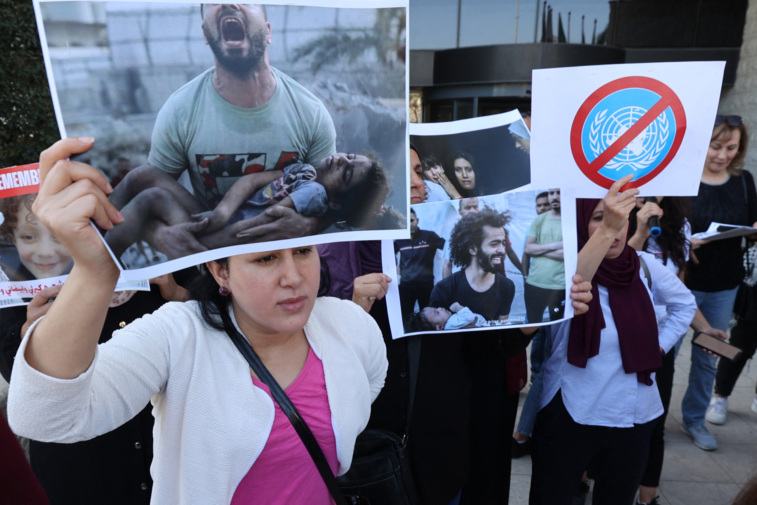 Palestinians representing civil organisations for women protest outside the UN offices in the West Bank city of Ramallah.