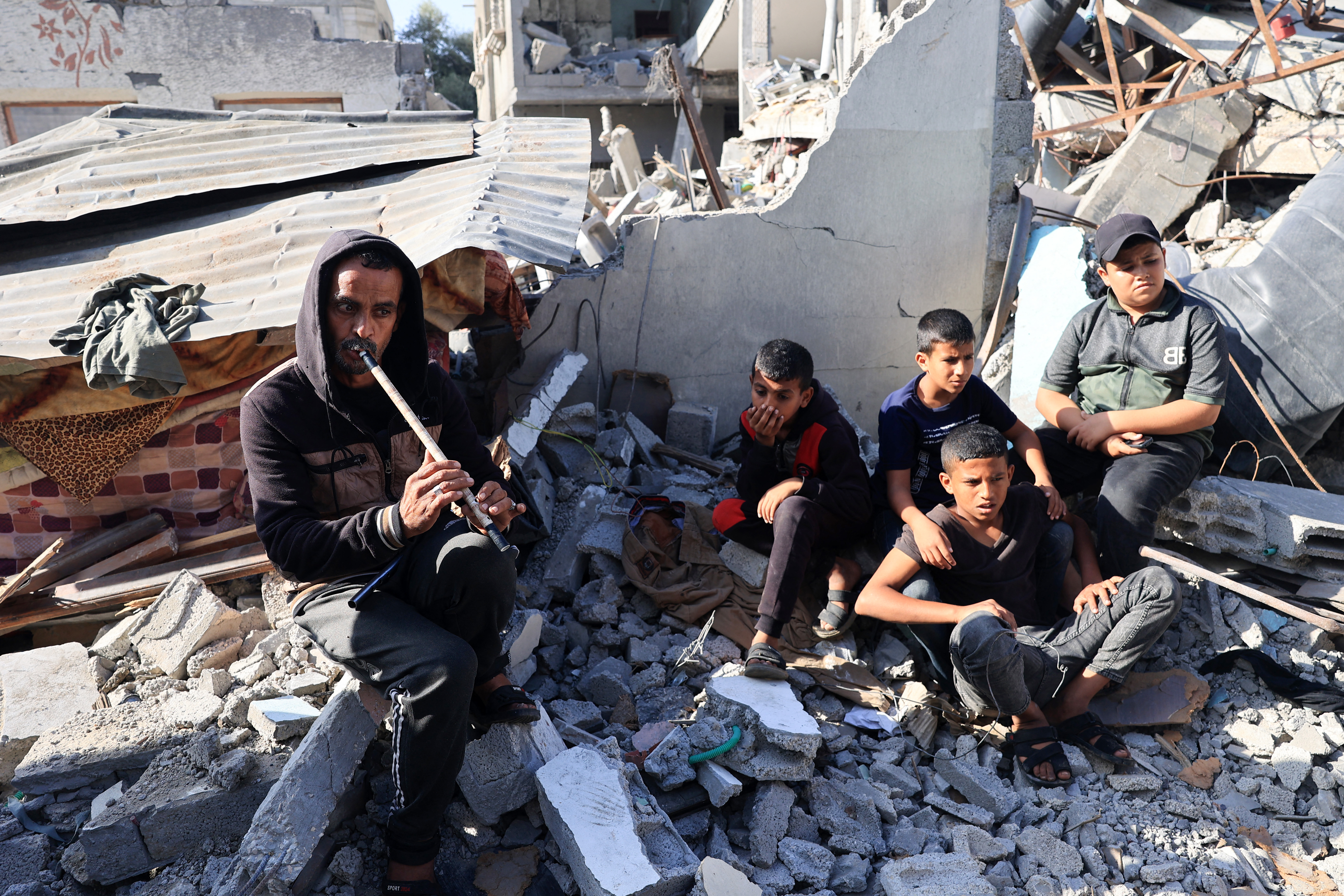 Imed, Amal al-Robayaa's husband, plays the ney