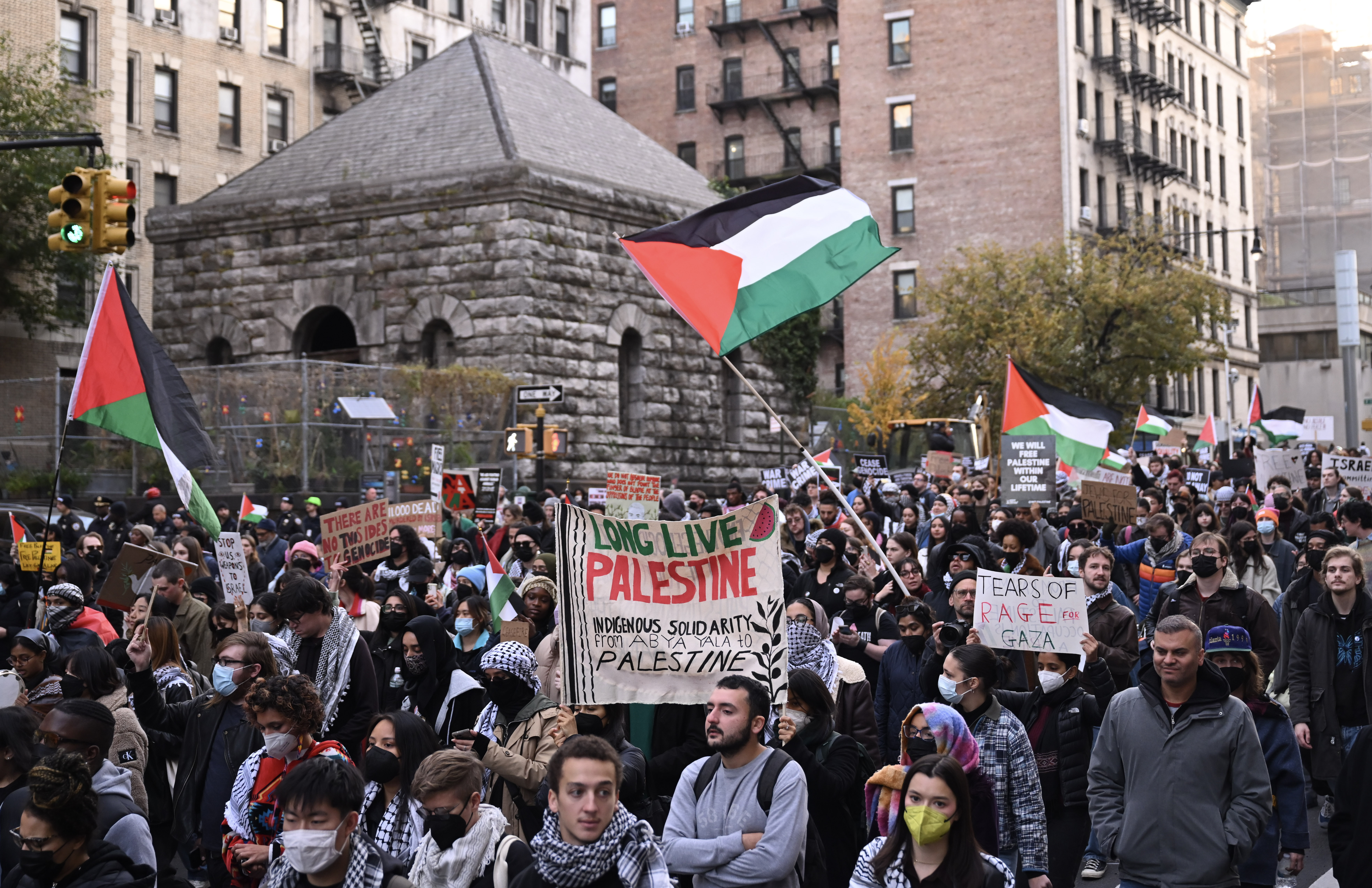 People, holding Palestinian flags and banners, gathering demonstrate to show solidarity with Palestinians in the Gaza Strip.