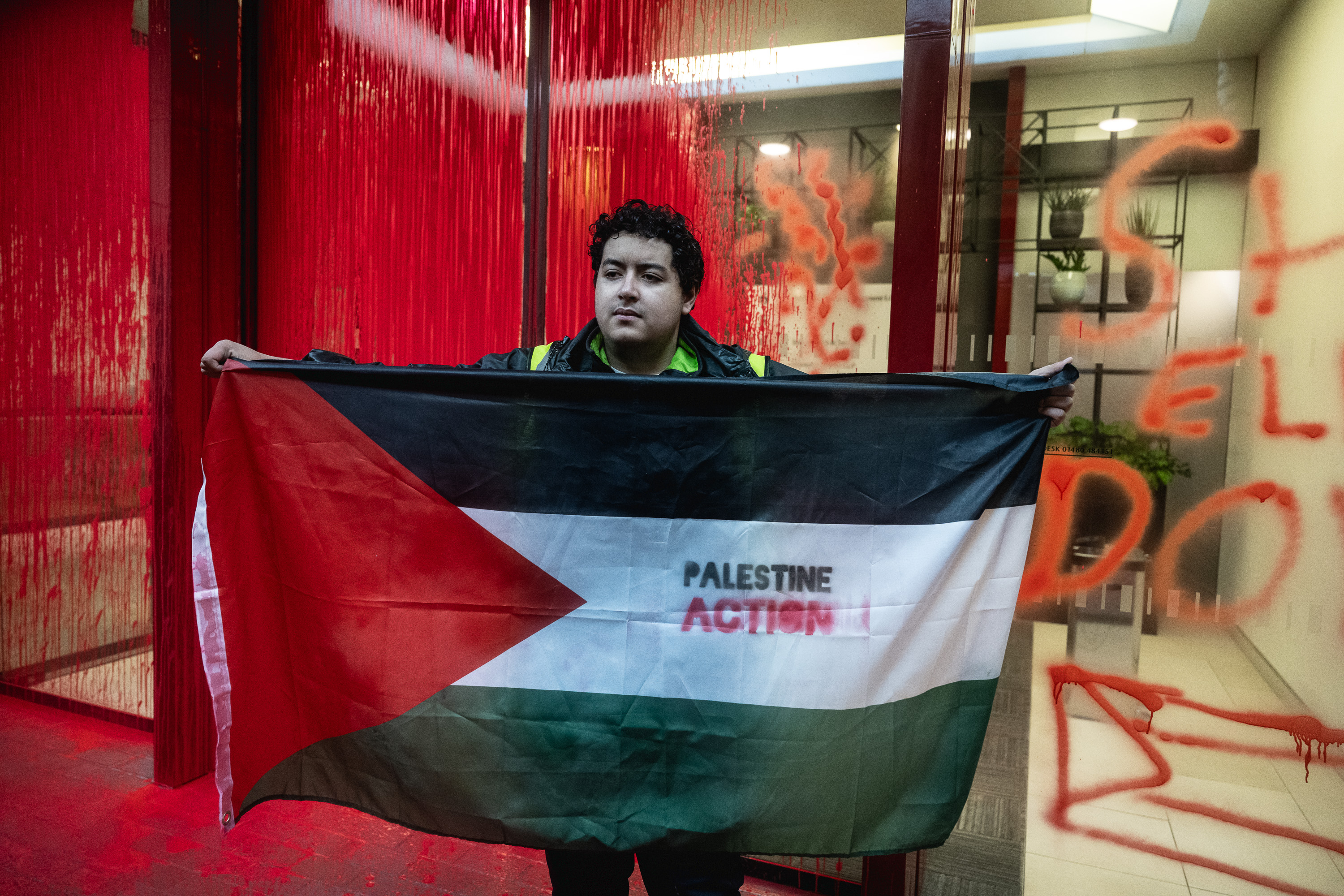 Activists from Palestine Action spray paint over the London offices of the Arms Company Leonardo which supplies fighter jets to the Israeli military on November 2, 2023 in London, England [Guy Smallman/Getty Images]