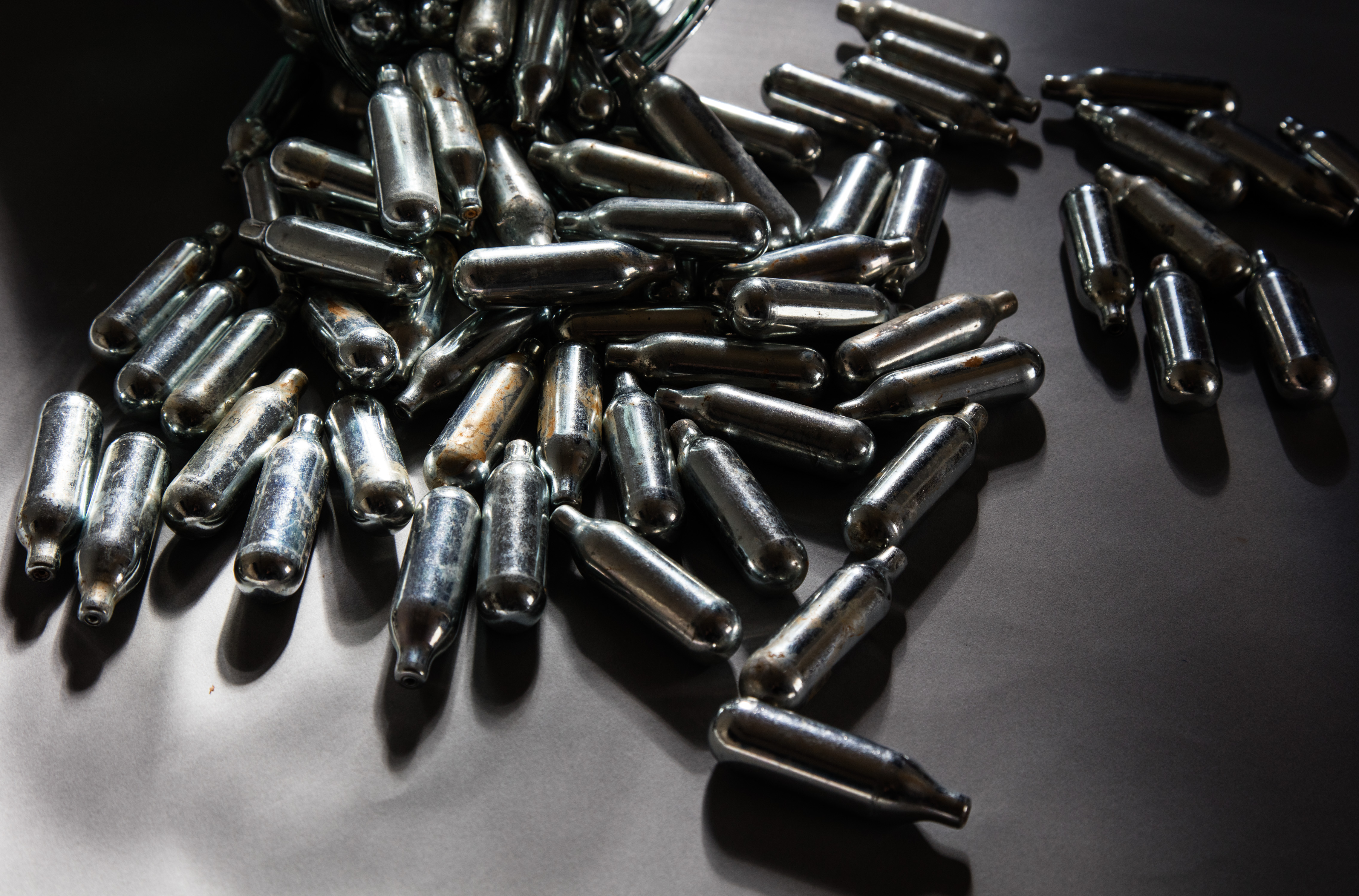 Some of the thousands of empty canisters of nitrous oxide collected at the end of a music festival are seen on October 14, 2015, in Bristol, England