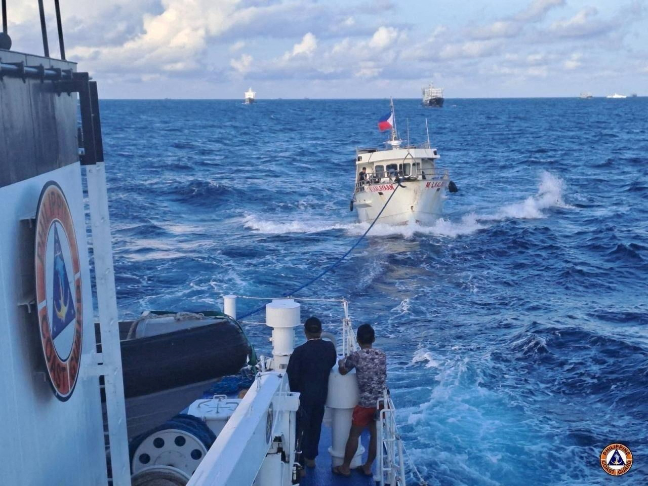 The Philippines resupply boat being towed by the coast guard after the incident with China