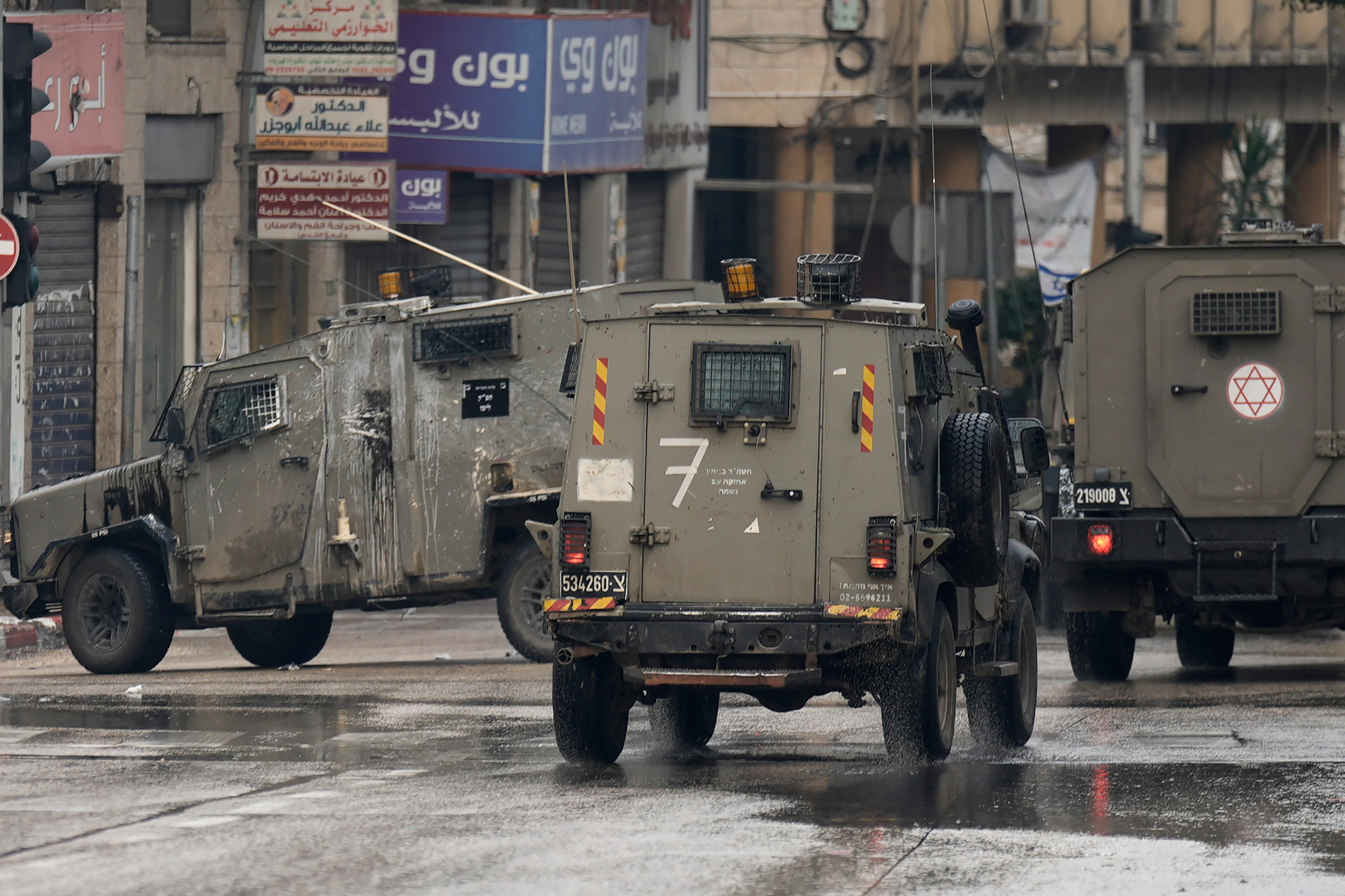 Israeli military vehicles are seen during a raid in the West Bank city of Nablus,