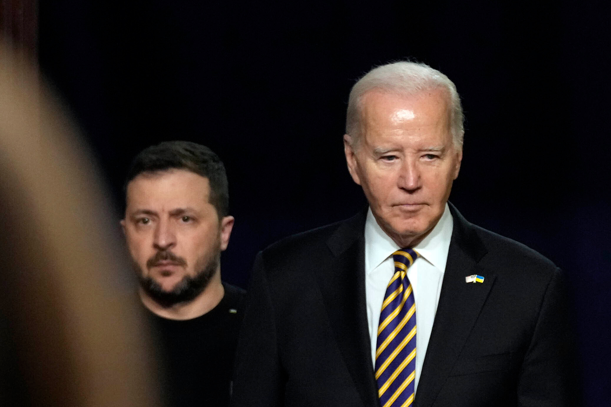 President Joe Biden and Ukrainian President Volodymyr Zelenskyy arrive for a news conference in the Indian Treaty Room in the Eisenhower Executive Office Building on the White House Campus, Tuesday, Dec. 12, 2023, in Washington. (AP Photo/Andrew Harnik)