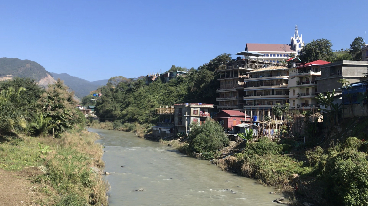 The village of Zokhawthar in Mizoram, India [at left] is separated from Myanmar by the Tiau river