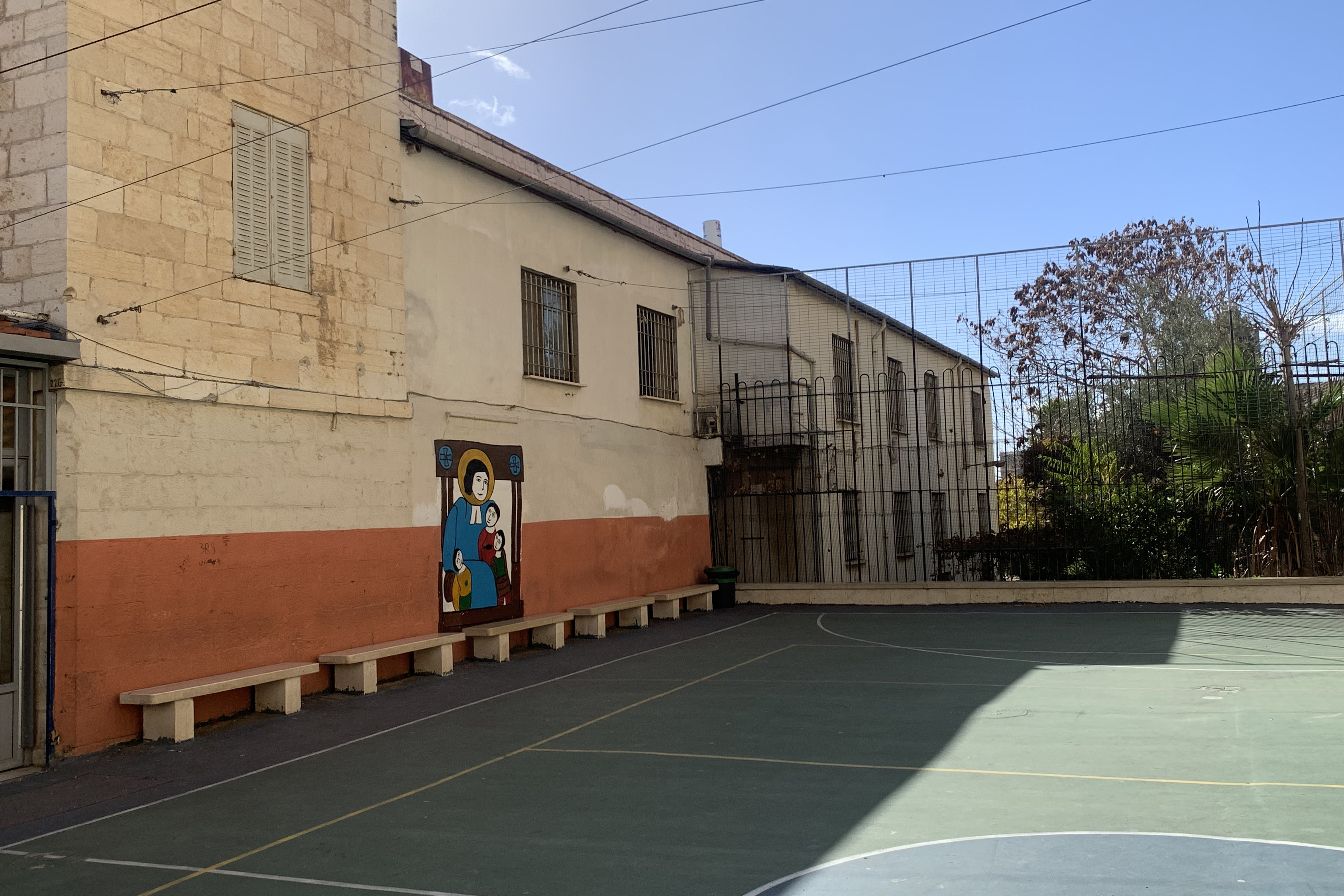 Inside the compound of College des Freres in Jerusalem’s Old City, there are none of the usual Christmas trees, decorations and gifts for the children as in previous years [Al Jazeera]
