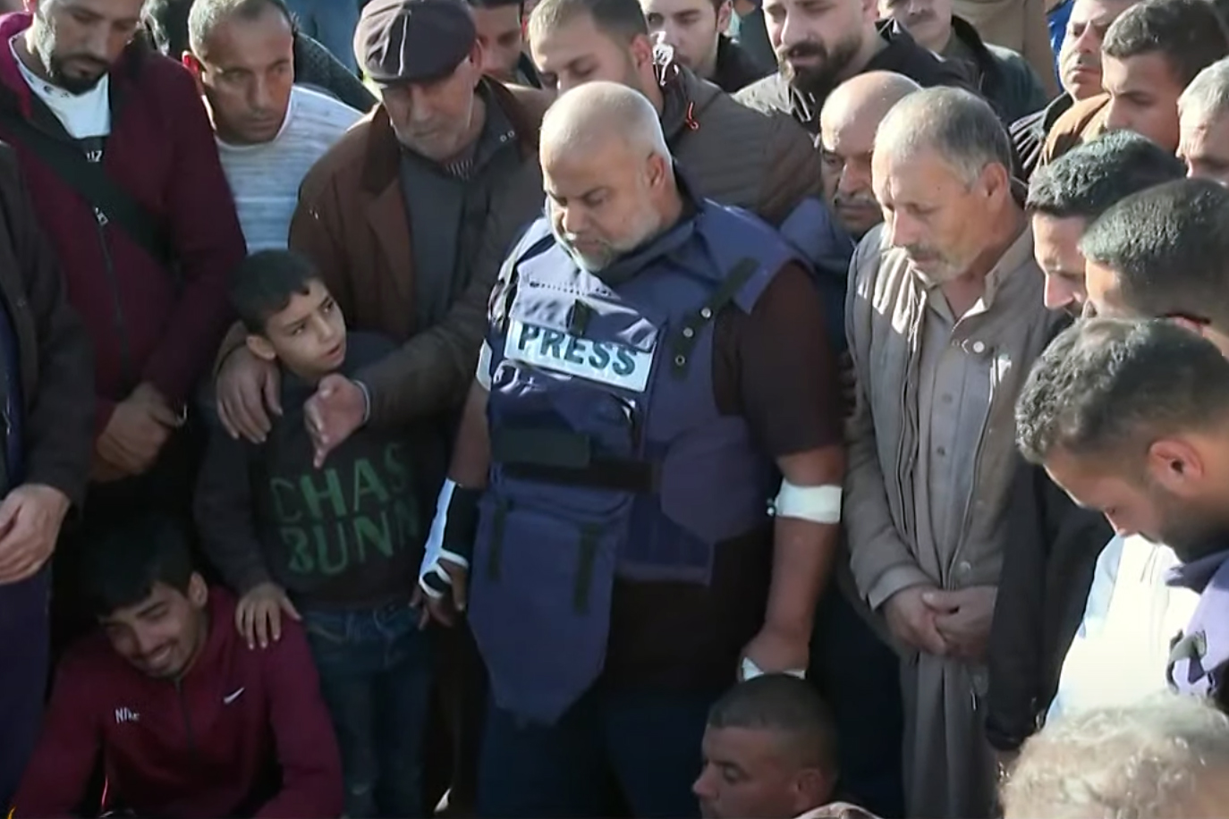 Wael Dahdouh, Al Jazeera Arabic’s bureau chief in Gaza who was also injured in the Israeli air raid that killed Samer Abudaqa, attends his funeral alongside dozens of mourners in Gaza’s southern city of Khan Younis on December 16