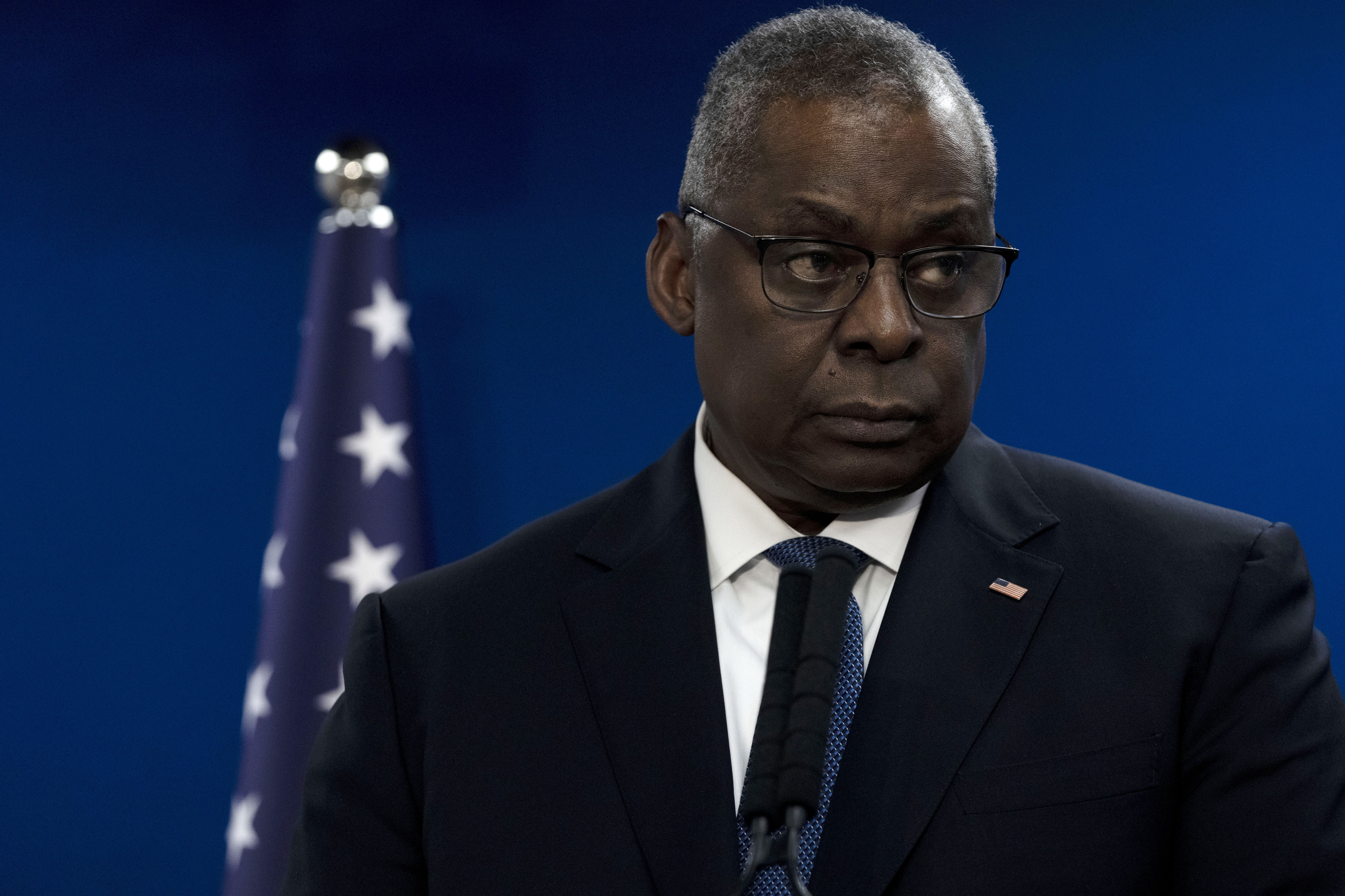 US defence secretary Lloyd Austin. He is speaking to the media and a US flag is behind him.