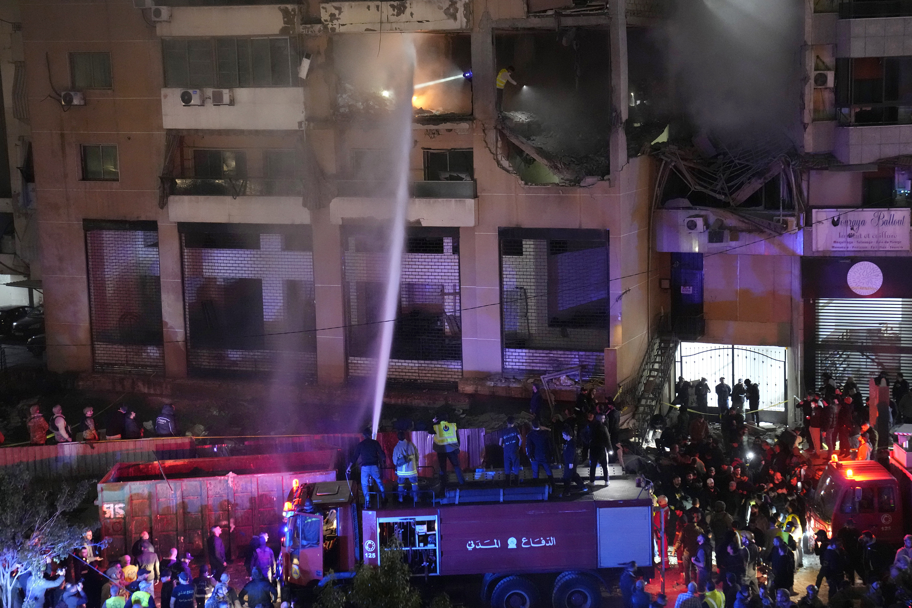 Firefighters extinguish the fire inside an apartment following a massive explosion in the southern suburb of Beirut, Lebanon, Jan 2, 2024