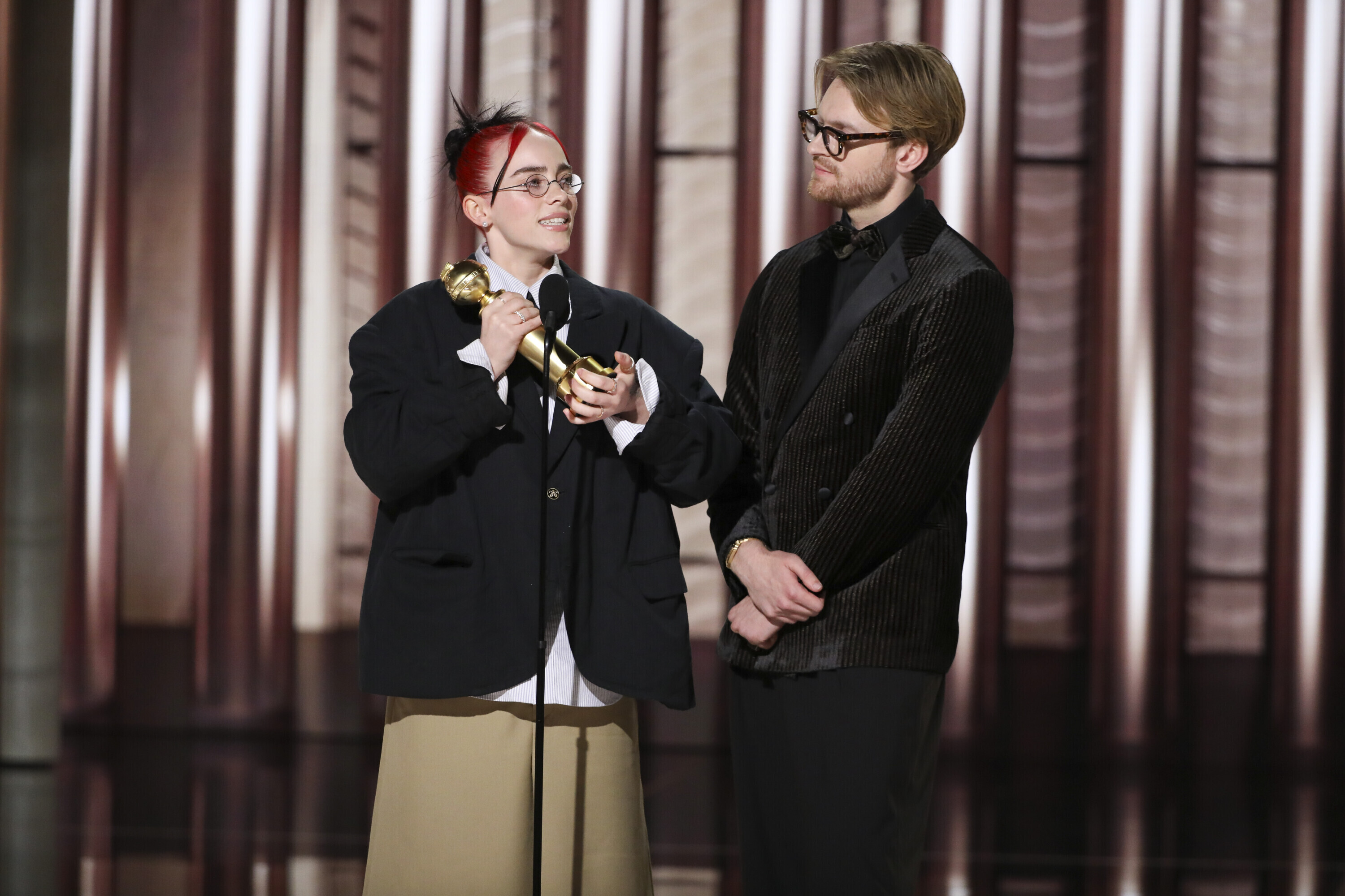 Billie Eilish and her brother Finneas O'Connell collect their Golden Globe. 