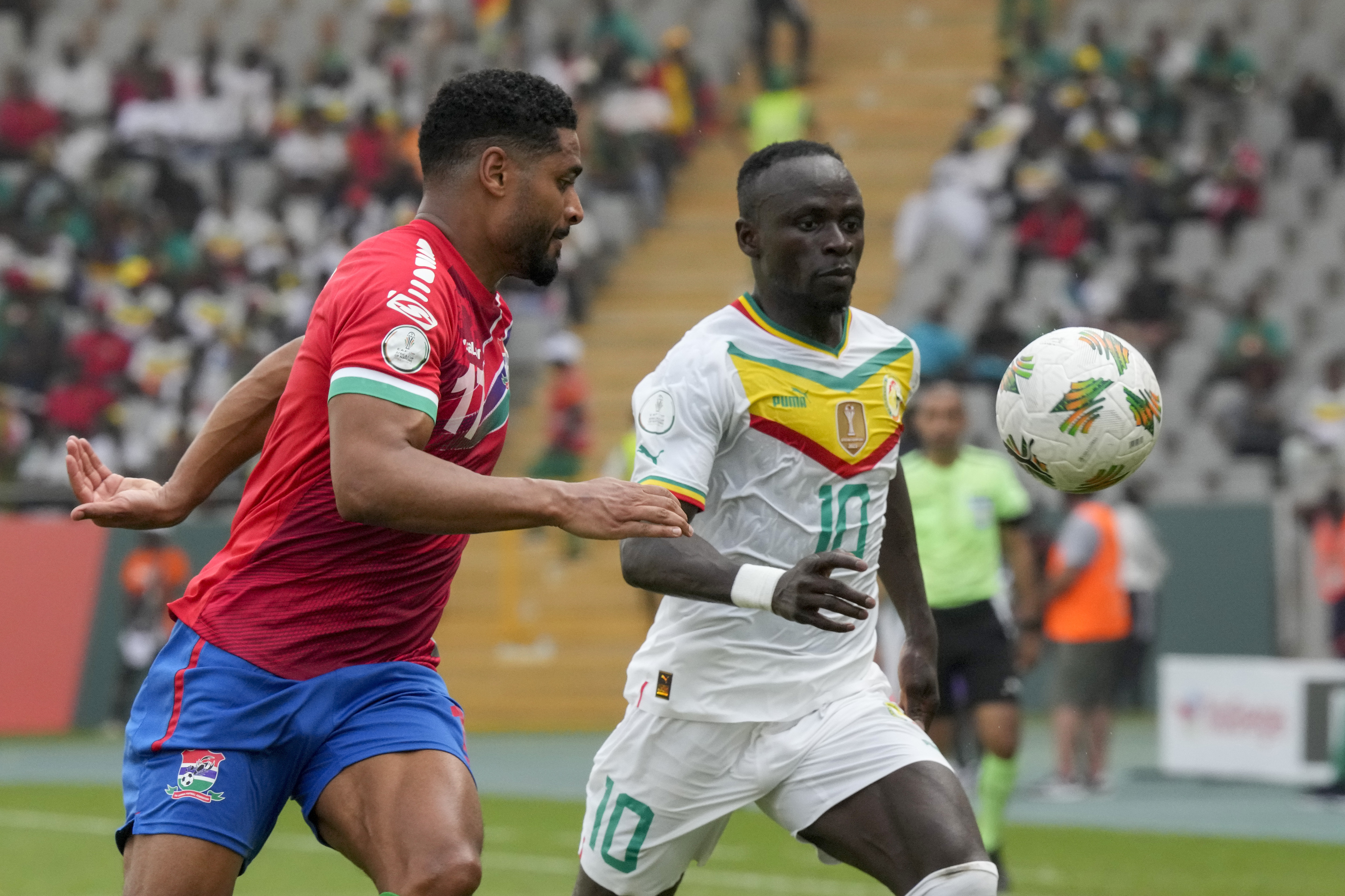 Senegal's Sadio Mane, right, vies for the ball with Gambia's Saidy Janko during the African Cup of Nations Group C soccer match between Senegal and Gambia at the Charles Konan Banny stadium in Yamoussoukro, Ivory Coast, Monday, Jan. 15, 2024. (AP Photo/Sunday Alamba)