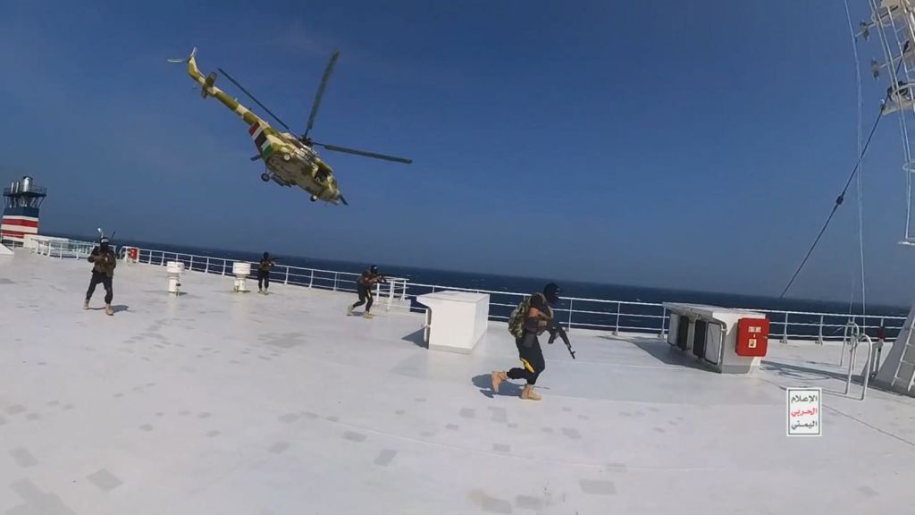 This handout screen grab captured from a video shows Yemen's Houthi fighters' takeover of the Galaxy Leader Cargo in the Red Sea coast off Hudaydah, on November 20, 2023 in the Red Sea, Yemen. On Monday, the Houthi movement in Yemen released footage and photos of the Houthi-run coastguard taking over the Israeli-linked Galaxy Leader Vessel in the Red Sea, which had 52 people onboard.